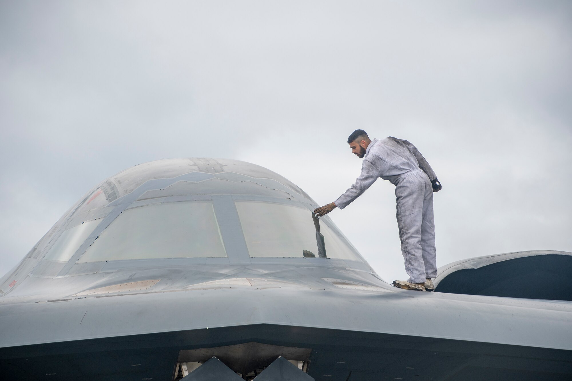 Airmen assigned to the 131st and 509th Maintenance Squadrons conduct post-flight maintenance on a B-2 Spirit stealth bomber at Keflavik Air Base, Iceland, August 26, 2021. The stealth bombers integrated with Royal Air Force Typhoon fighter jets in support of a Bomber Task Force mission to enhance interoperability and and capabilities with NATO allies and partners across the European theater. (U.S. Air National Guard photo by Master Sgt. John E. Hillier)