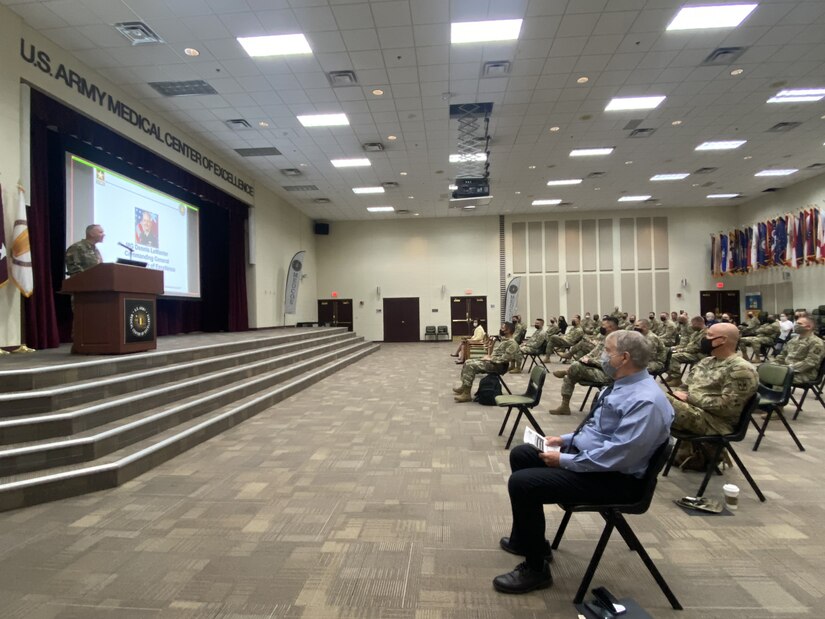 Service members participate in a summit.