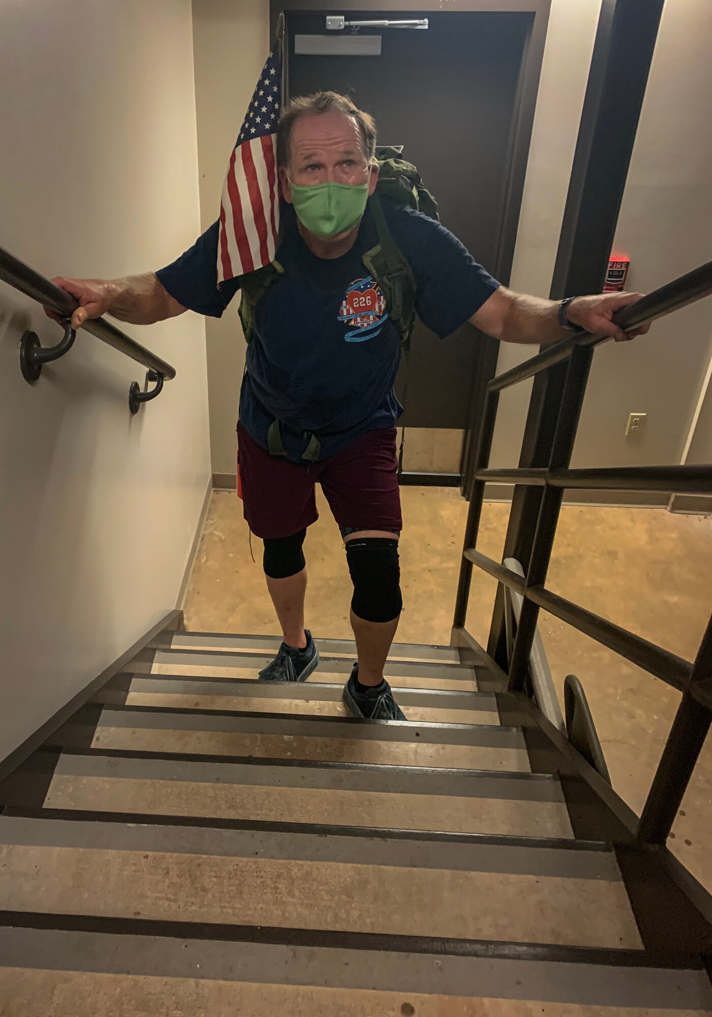Albert DeRubbio climbs stairs during the Stair Climb Challenge