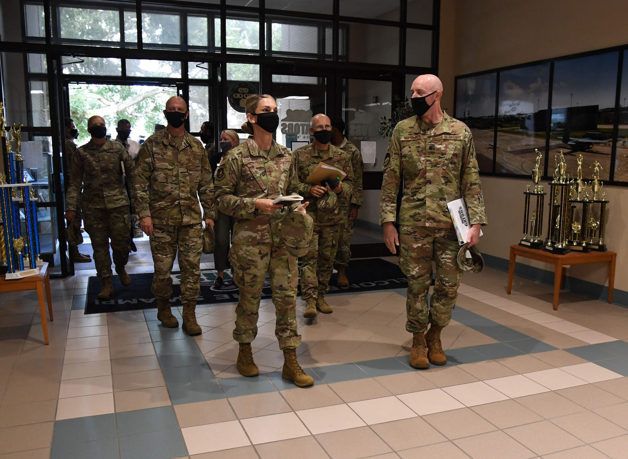 U.S. Air Force Maj. Gen. Michele Edmondson, Second Air Force commander, is escorted inside Cody Hall by Lt. Col. Matthew Hopkins, 334th Training Squadron commander, during an immersion tour at Keesler Air Force Base, Missisippi, Sept. 13, 2021. Edmondson toured the 334th TRS to observe innovations in air traffic control training. (U.S. Air Force photo by Kemberly Groue)