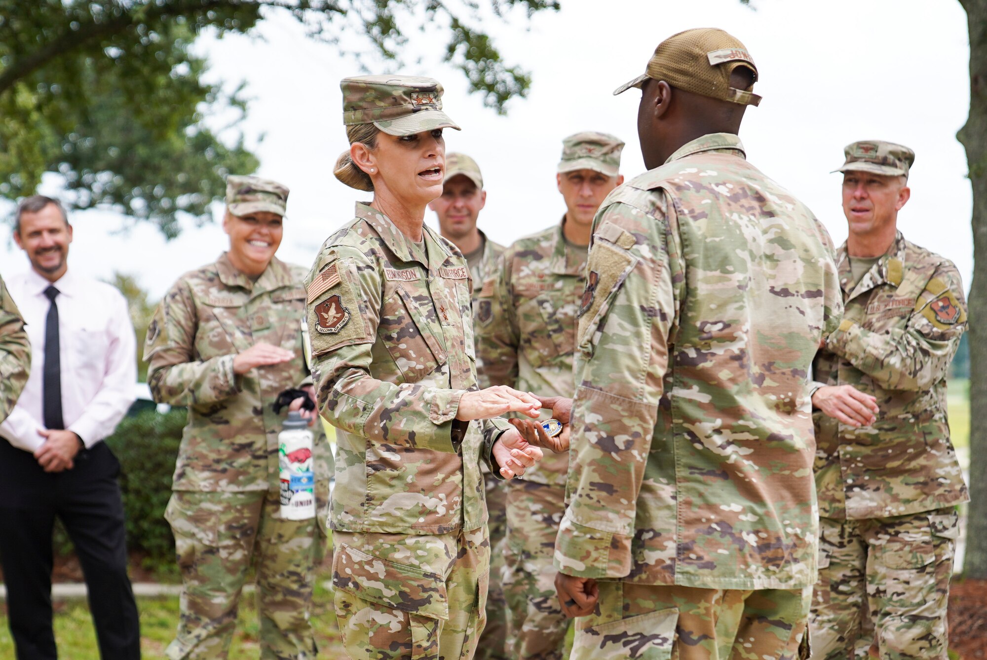 U.S. Air Force Michele C. Edmondson, Second Air Force commander, coins Tech. Sgt. Richard Jones, 81st Civil Engineering Squadron airmen dorm leader, during an immersion tour at Keesler Air Force Base, Missisippi, September 13, 2021. Edmondson visited the 81st Medical Group, the 81st Security Forces Squadron, the Sablich Center and more as part of her tour of the 81st Training Wing. (U.S. Air Force photo by Senior Airman Spencer Tobler)