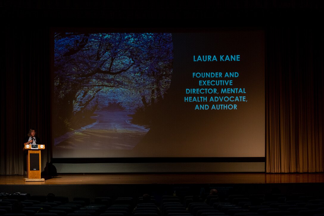 Laura Kane, founder and executive director of Marshmallow’s HOPE, speaks to Airmen, civilians and family members during a suicide prevention presentation in the base theater at Edwards Air Force Base Calif., Sept. 1. (Air Force photo by Kyle Brasier)