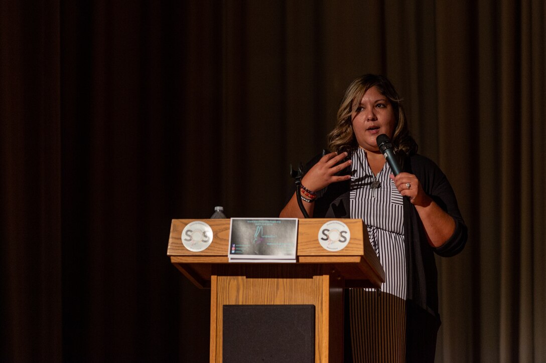 Laura Kane, founder and executive director of Marshmallow’s HOPE, speaks to Airmen, civilians and family members during a suicide prevention presentation in the base theater at Edwards Air Force Base Calif., Sept. 1. (Air Force photo by Kyle Brasier)