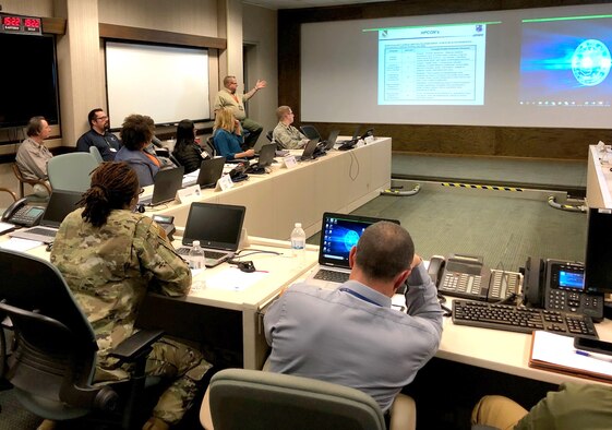 In fall of 2019, AEDC team members from various offices take part in a tabletop exercise in the Emergency Operations Center at Arnold Air Force Base. Frequent exercises, organized and overseen by the AEDC Office of Emergency Management, are held to help prepare EOC team members should a natural or man-made disaster affect the base. (U.S. Air Force photo) (This image was altered by obscuring badges for security purposes.)