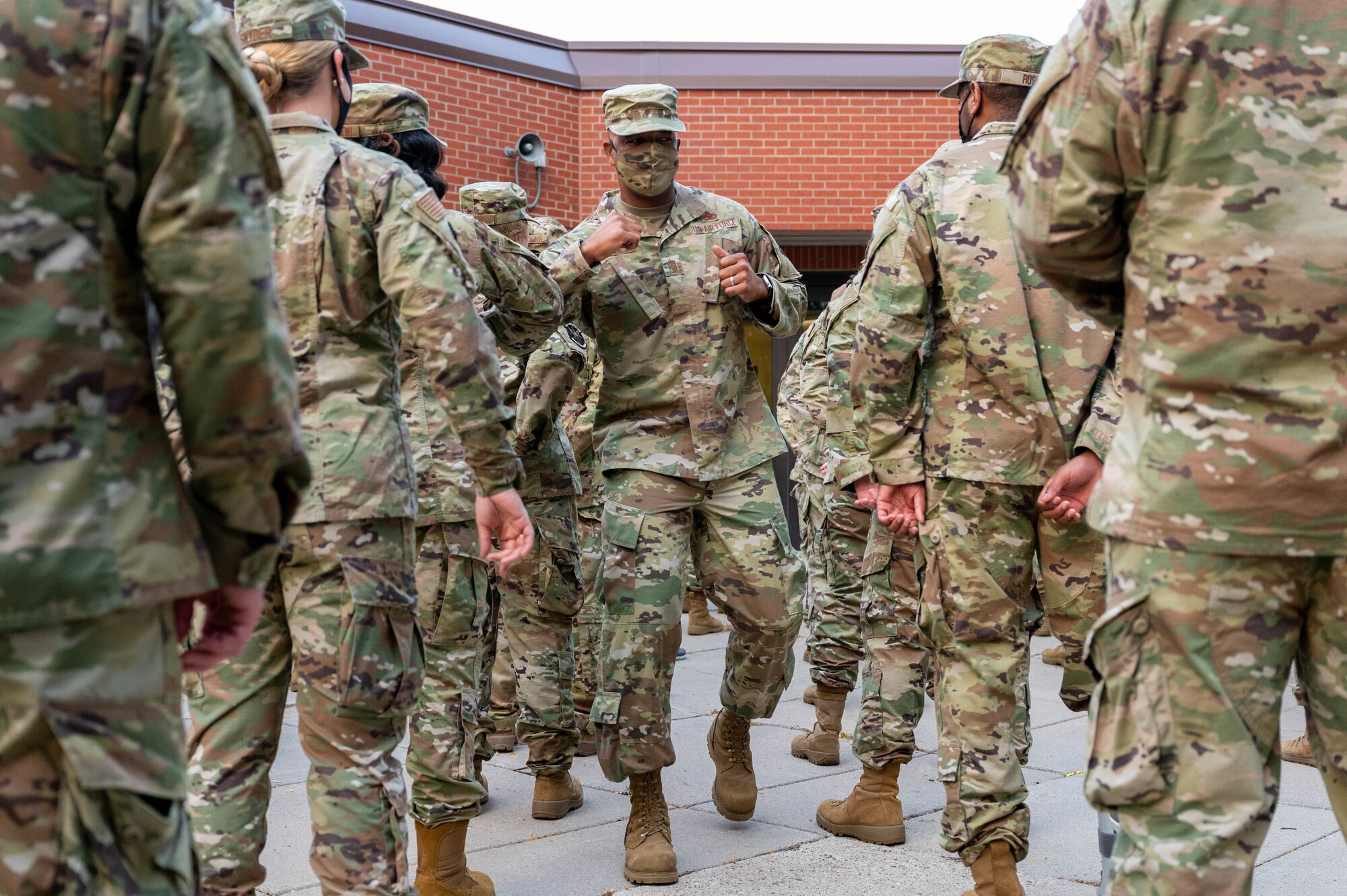 Chief Master Sgt. Tim White Jr., AFRC’s command chief master sergeant, greets Airmen with elbow bumps during a formation at the 934th Aeromedical Staging Squadron at the Minneapolis-St. Paul Air Reserve Station on Sept. 11, 2021. White met with the Airmen as a part of his tour of the base and facilities. (U.S. Air Force photo by Master Sgt. Trevor Saylor)