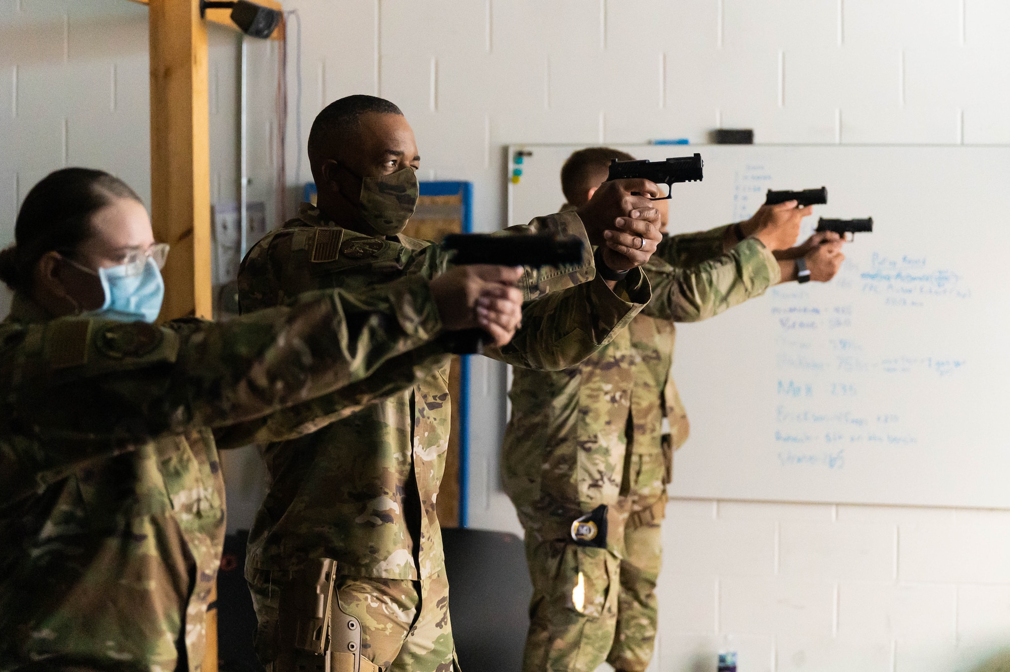 Chief Master Sgt. Tim White Jr., AFRC’s command chief master sergeant, takes aim at a target during a tour of the facilities at the 934th Security Forces Squadron at the Minneapolis-St. Paul Air Reserve Station on Sept. 11, 2021. The Fire Arms Training Simulator is used by the 934 SFS to maintain proficiency when the members are unable to use the firing range. (U.S. Air Force photo by Master Sgt. Trevor Saylor)