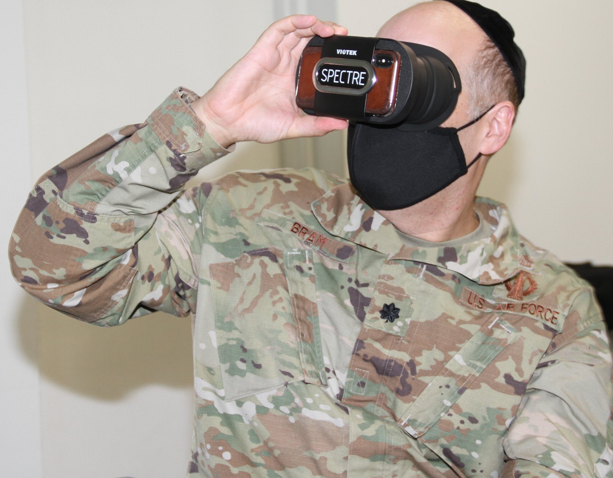 Chaplain (Lt. Col.) Michael Bram of Edwards Air Force Base tries the virtual reality headset for the Third Room application.