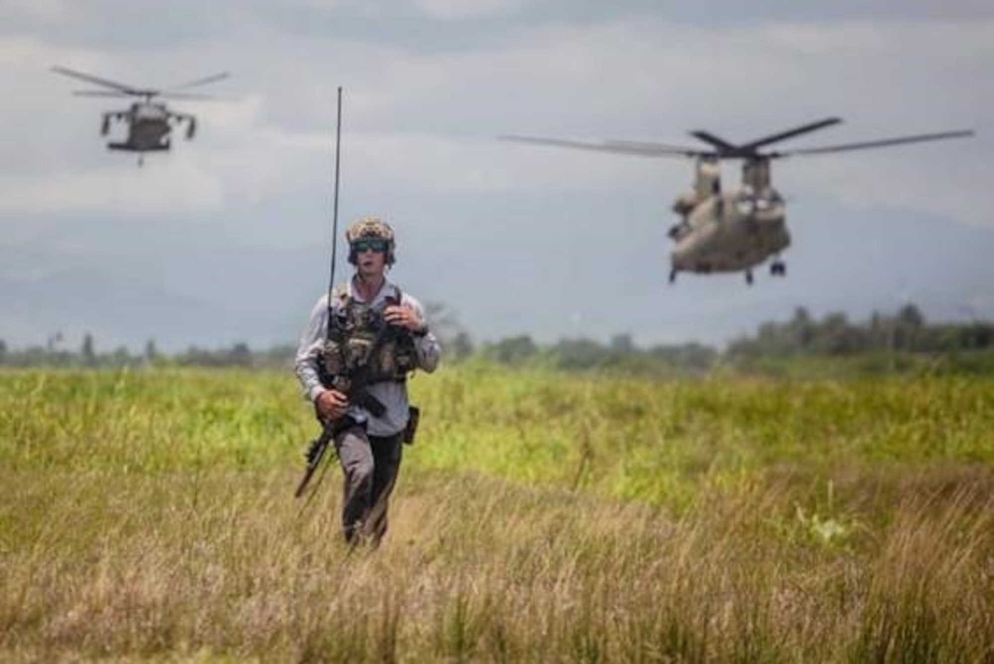 U.S. Air Force Special Tactics operator prepares to hand off an injured patient after an emergency medical evacuation in the western part of Haiti. Special Tactics Airmen responded to a request to augment Joint Task Force-Haiti relief efforts after a 7.2 magnitude earthquake hit the country Aug. 14, 2021.
