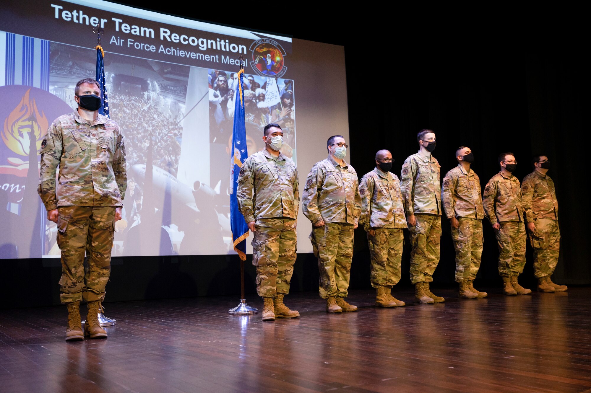 U.S. Air Force Airmen from the 375th Communications Support Squadron receive an Air Force Achievement Medals in the Base Auditorium at Scott Air Force Base, Ill., September 2, 2021. The individuals photographed are members of what is called “Tether Team” are programmers and software and application developers who recently were recognized for their contributions in Operation Allies Refuge. (U.S. Air Force photo by Staff Sgt. Dalton Williams)