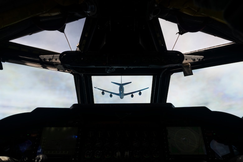 A U.S. Air Force KC-135 Stratotanker, assigned to the 117th Air Refueling Squadron, Kansas Air National Guard, prepares to refuel a B-52H Stratofortress, assigned to the 2nd Bomb Wing, Barksdale Air Force Base, Louisiana, over the Indo-Pacific region, during a Bomber Task Force mission, Sept. 14, 2021. The B-52 is a long range bomber with a range of approximately 8,800 miles, enabling rapid support of Bomber Task Force missions or deployments and reinforcing global security and stability. (U.S. Air Force photo by Staff Sgt. Devin M. Rumbaugh)