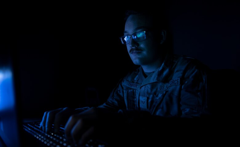 U.S. Air Force Senior Airman Logan Thirion, Air Mobility Command application developer, and the rest of the Tether Team are programmers and application developers for the Air Force. Within their primary duties, they create, alter and repair coding used for Air Force application. (U.S. Air Force illustrative photo by Staff Sgt. Solomon Cook)