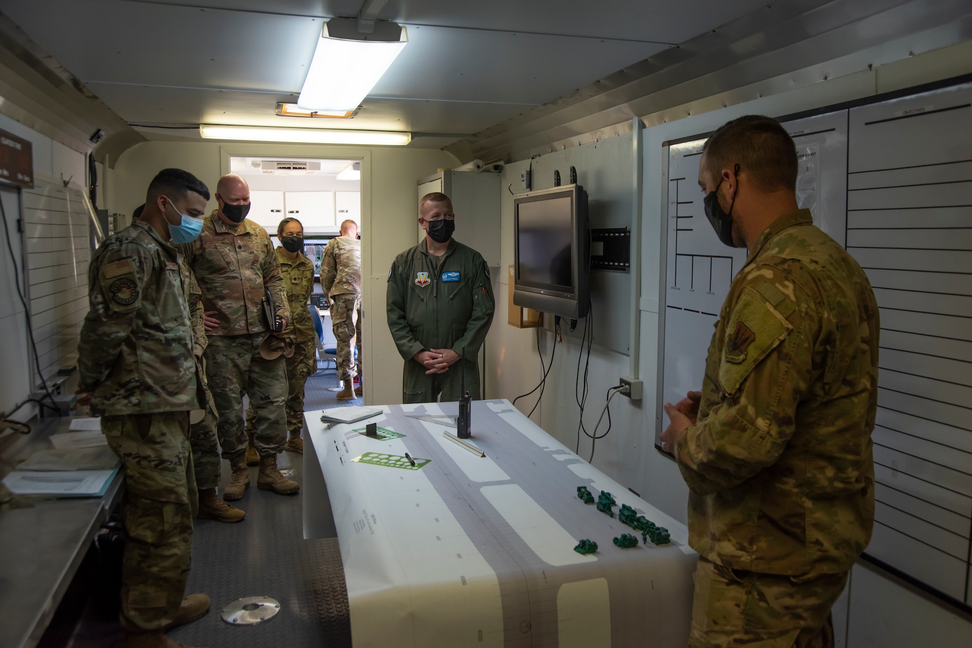 Airmen briefs the Colonel on how exercises are performed on runways.