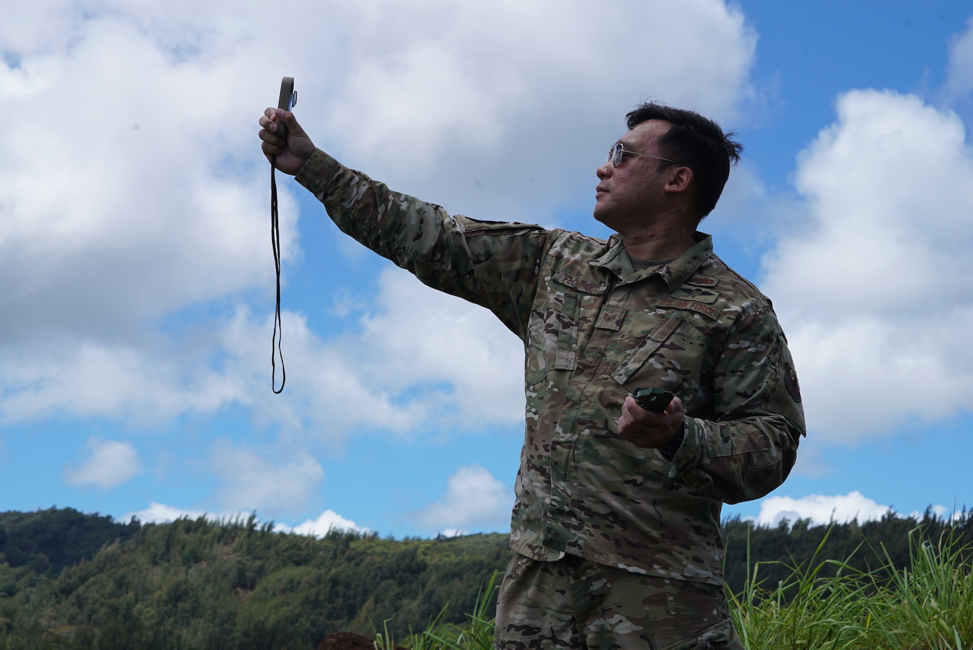 353 Aerial Delivery Support Branch Airmen gathers environmental data before an incoming equipment drop