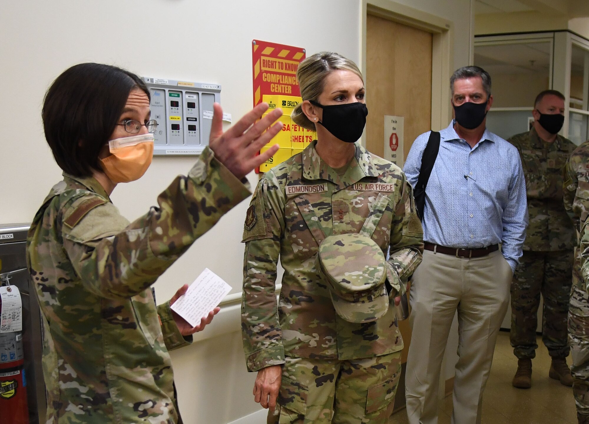 U.S. Air Force Maj. Suzanne Latch, 81st Inpatient Operation Squadron critical care nurse, briefs Maj. Gen. Michele Edmondson, Second Air Force commander, on the daily operations of the intermediate critical care unit (2D) during an immersion tour inside the Keesler Medical Center at Keesler Air Force Base, Missisippi, Sept. 13, 2021. While at the Medical Center, Edmondson also visited the Drive Up COVID Clinic to view the testing process first hand. (U.S. Air Force photo by Kemberly Groue)