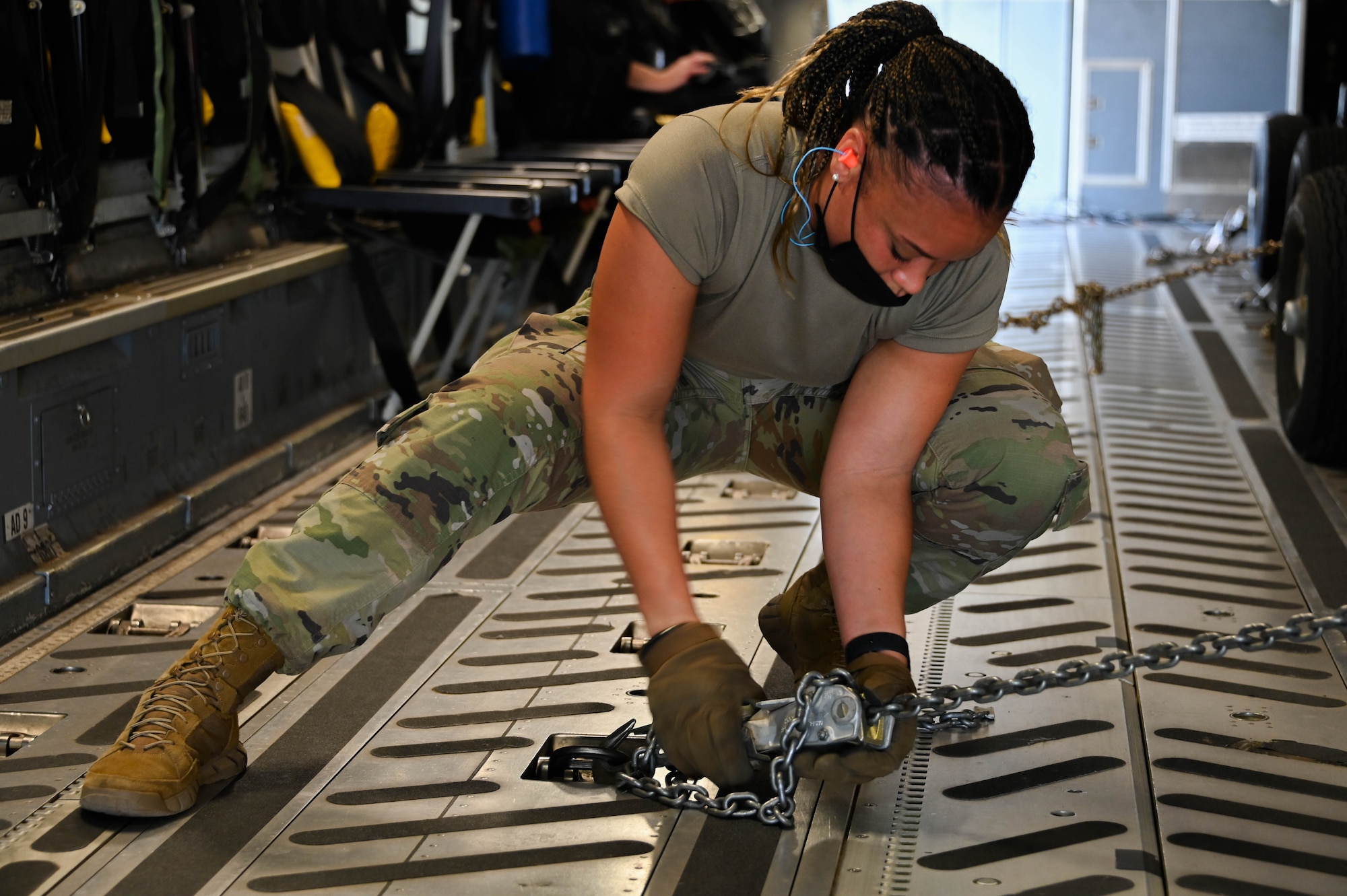 Senior Airman Felix Puello, 49th Logistics Readiness Squadron air transportation journeyman, pushes a generator onto a C-17 Globemaster III at Holloman Air Force Base, New Mexico, Sept. 9, 2021. Approximately 40 Airmen travelled to Marine Corps Base Hawaii with MQ-9 Reaper assets for programmed flying training and instructor training. (U.S. Air Force photo by Airman 1st Class Kayla Christenson)
