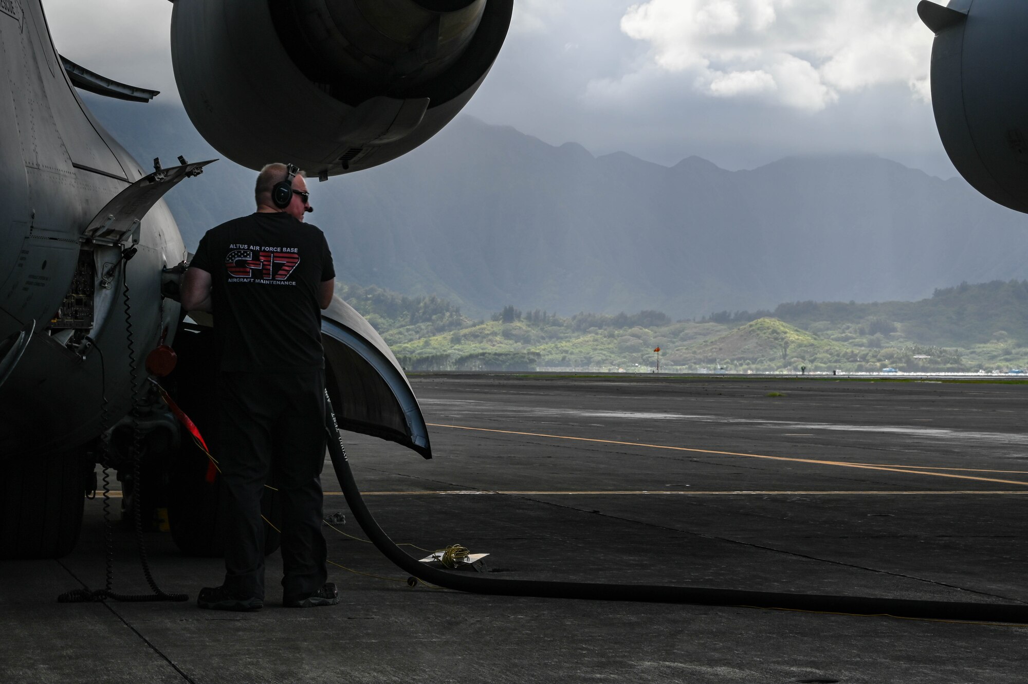 Johnathan Lambert, 97th Maintenance Squadron crew chief, fuels a C-17 Globemaster III at Marine Corps Base Hawaii, Sept. 9, 2021. Two C-17 maintainers from Altus AFB ensured the cargo aircraft was working properly throughout exercise Agile Combat Employment Reaper. (U.S. Air Force photo by Airman 1st Class Kayla Christenson)