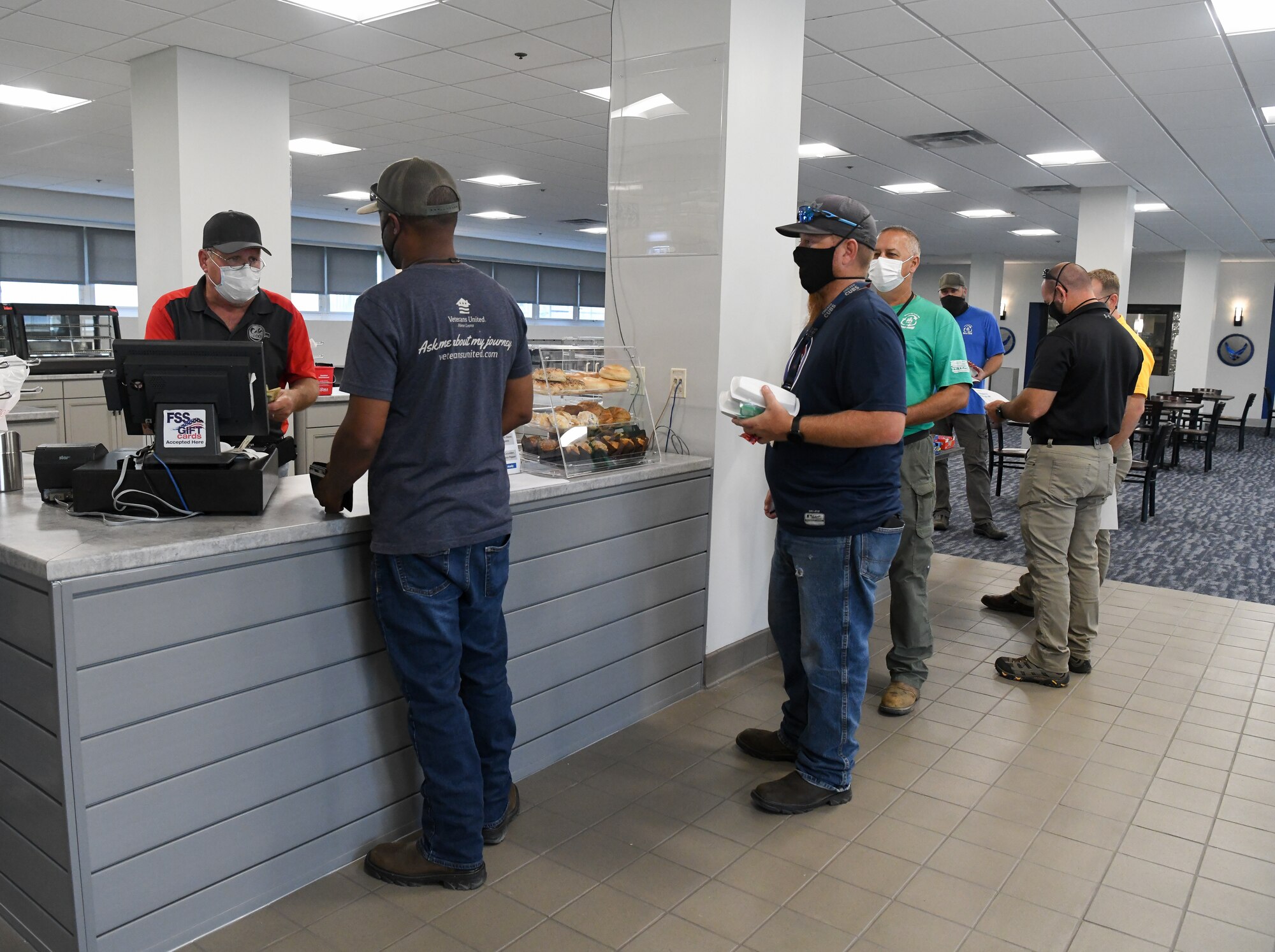 Steve Barnes, a Café 100 employee, serves customers, Sept. 9, 2021, at Arnold Air Force Base, Tenn. The dining facility reopened after a months-long renovation. (U.S. Air Force photo by Jill Pickett)