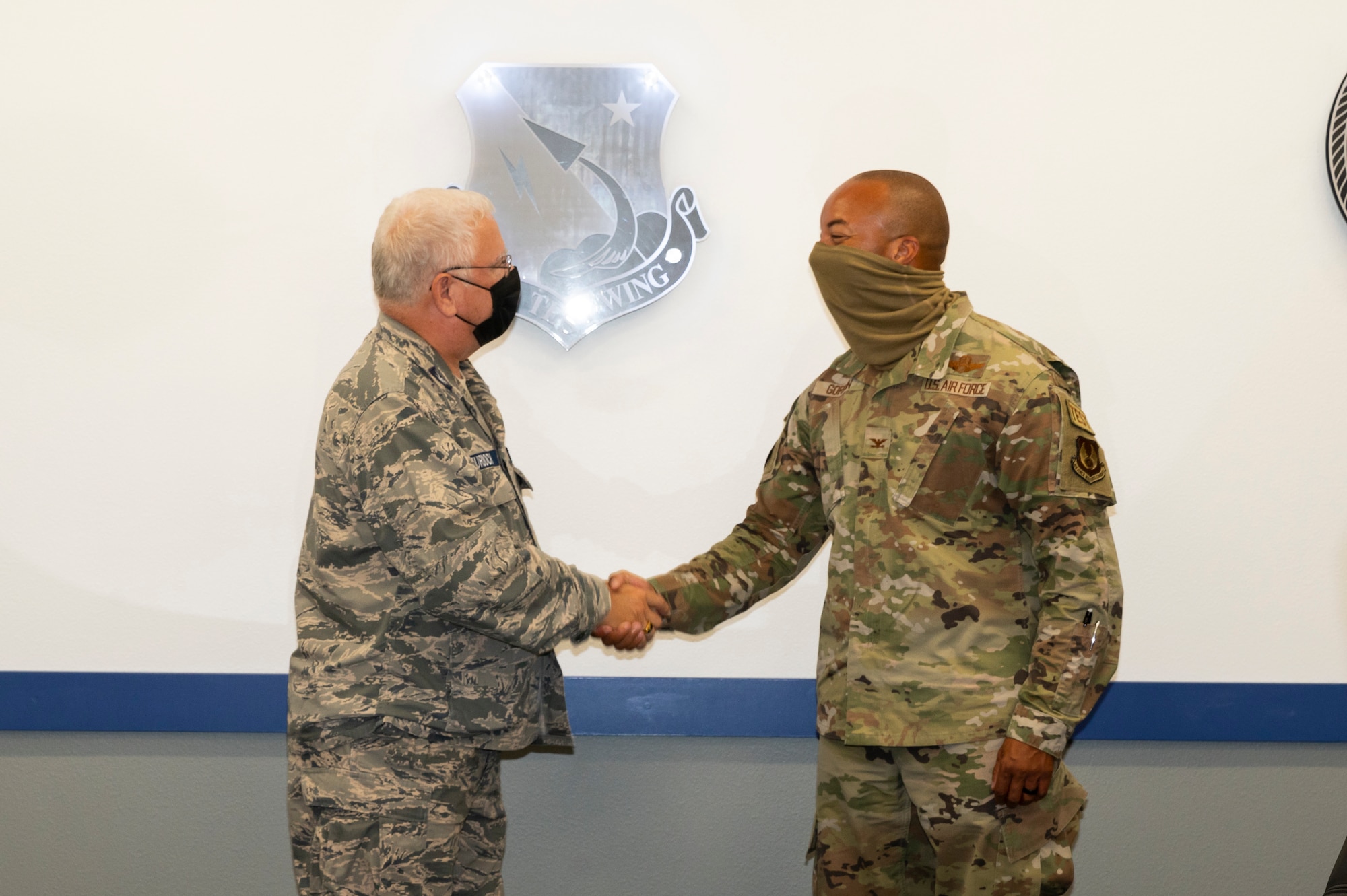 Civil Air Patrol Chief of Chaplains emeritus Chaplain (Col.) John Murdoch shakes hands with Col. Randel Gordon, 412th Test Wing Vice Commander, signifying a partnership between the Wing and CAP to augment the Wing's chaplain staff at Edwards Air Force Base, California, Sept. 10. (Air Force photo by Katherine Franco)