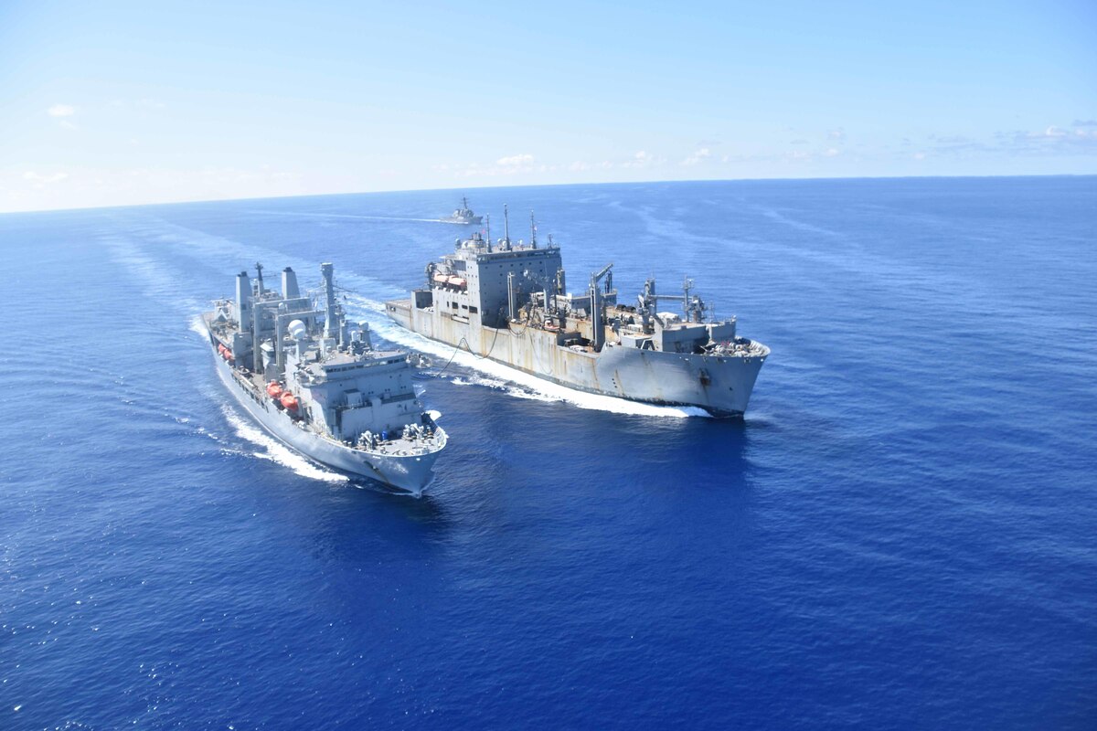 Ships sail side by side.