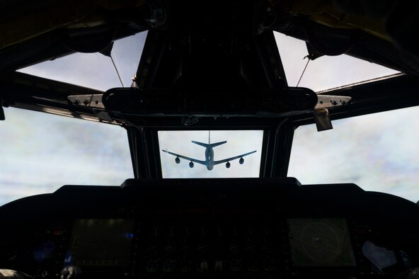 A U.S. Air Force KC-135 Stratotanker, assigned to the 117th Air Refueling Squadron, Kansas Air National Guard, prepares to refuel a B-52H Stratofortress, assigned to the 2nd Bomb Wing, Barksdale Air Force Base, Louisiana, over the Indo-Pacific region, during a Bomber Task Force mission, Sept. 14, 2021. The B-52 is a long range bomber with a range of approximately 8,800 miles, enabling rapid support of Bomber Task Force missions or deployments and reinforcing global security and stability. (U.S. Air Force photo by Staff Sgt. Devin M. Rumbaugh)