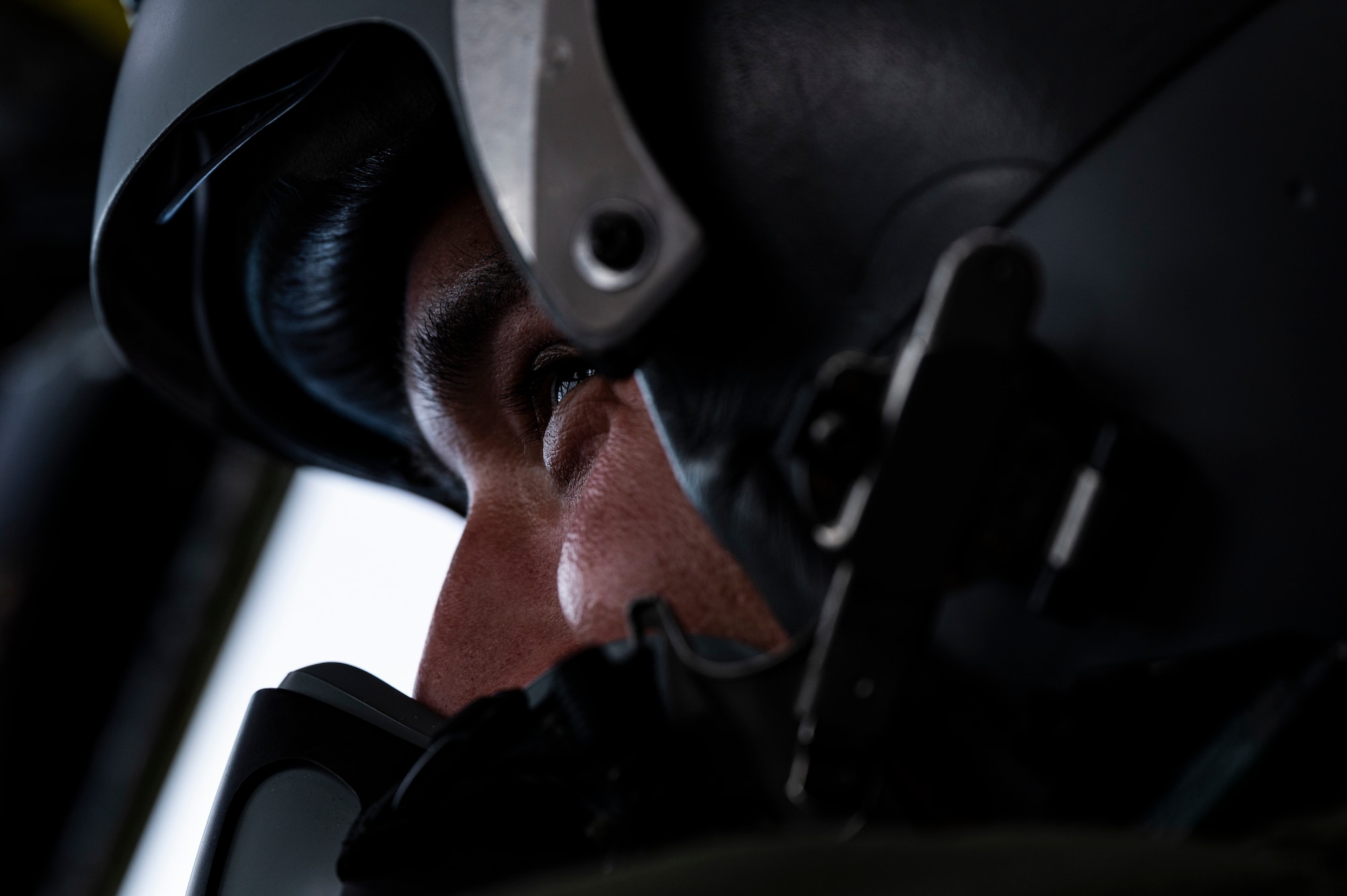 A U.S. Air Force aircrew member speaks to the pilot on a B-52H Stratofortress, assigned to the 2nd Bomb Wing, Barksdale Air Force Base, Louisiana, over the Indo-Pacific region during a Bomber Task Force mission, Sept. 14, 2021. The U.S. Air Force is engaged, postured, and ready with credible force to assure, deter, and defend in an increasingly complex security environment. (U.S. Air Force photo by Staff Sgt. Devin M. Rumbaugh)