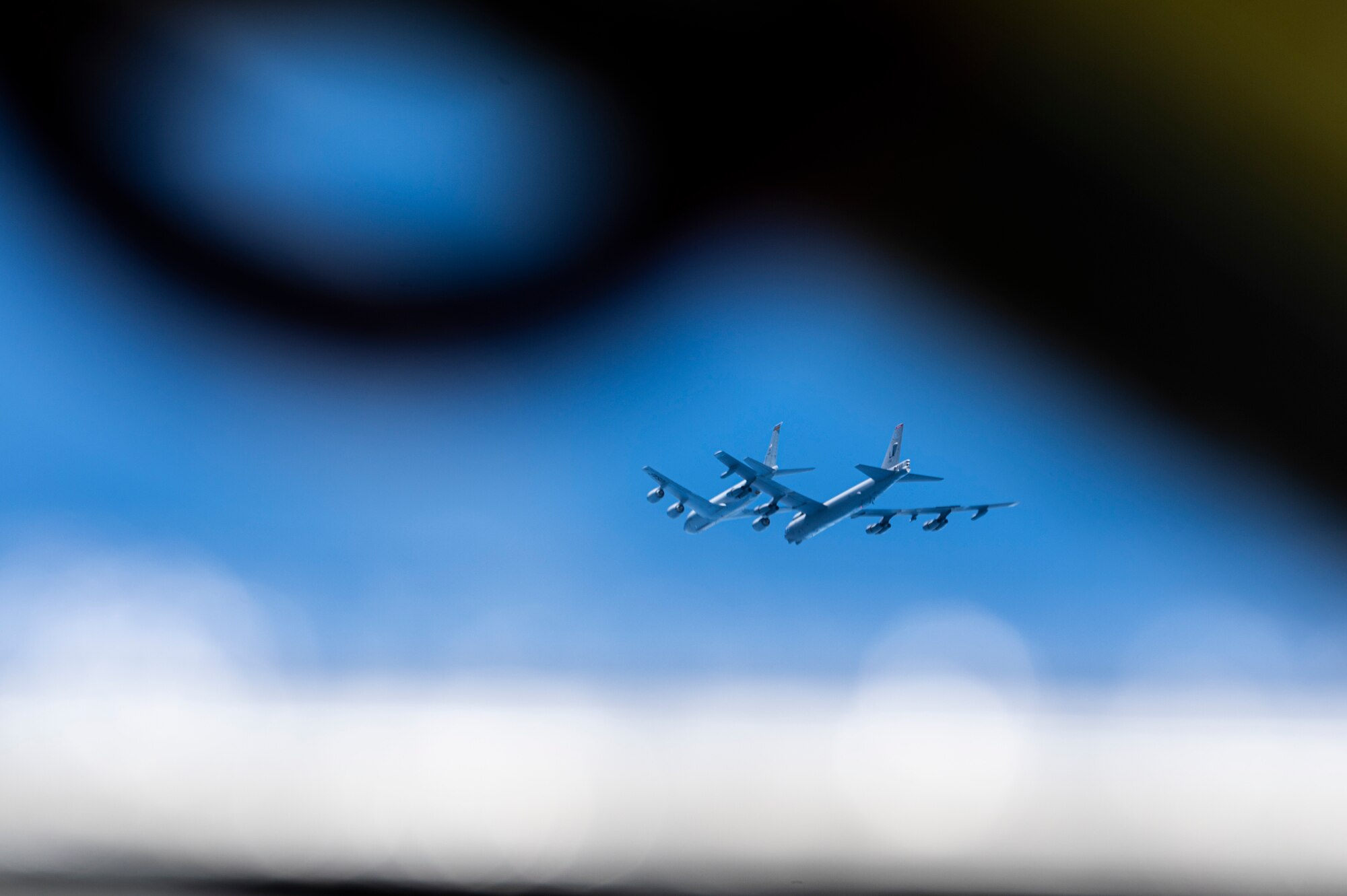 A U.S. Air Force KC-135 Stratotanker, assigned to the 117th Air Refueling Squadron, Kansas Air National Guard, refuels a B-52H Stratofortress, assigned to the 2nd Bomb Wing, Barksdale Air Force Base, Louisiana, over the Indo-Pacific region, during a Bomber Task Force mission, Sept. 14, 2021. The B-52 is a long range bomber with a range of approximately 8,800 miles, enabling rapid support of Bomber Task Force missions or deployments and reinforcing global security and stability. (U.S. Air Force photo by Staff Sgt. Devin M. Rumbaugh)