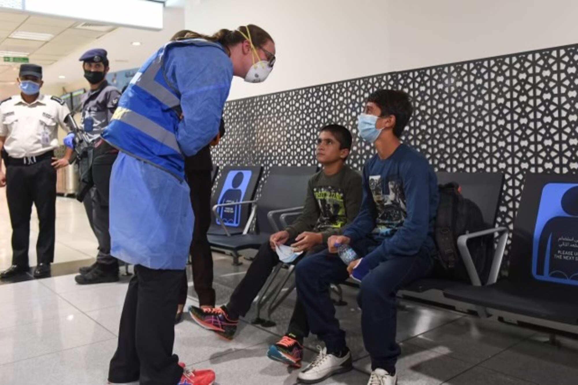 Airman talking to Afghans