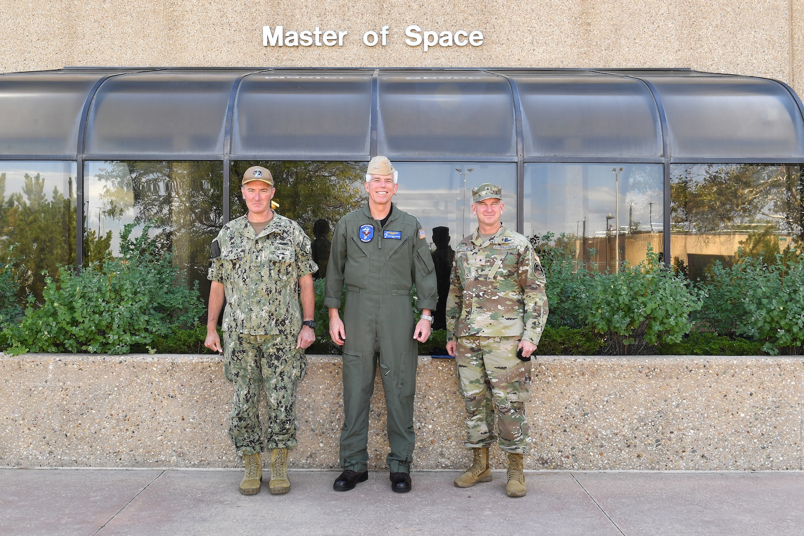 Military leaders pose for a photo during a visit to Schriever Space Force Base, Colorado.