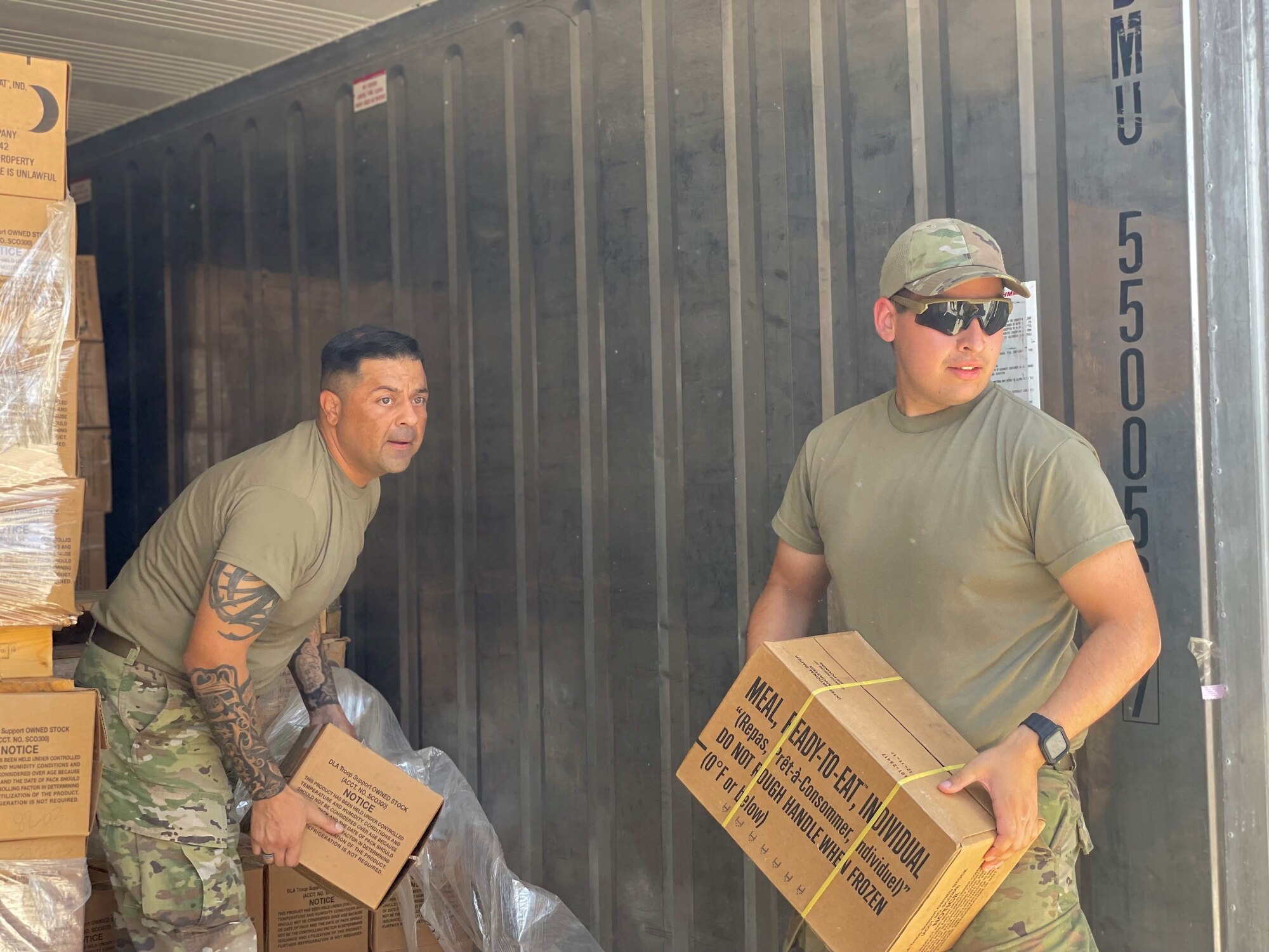 Airmen move boxes