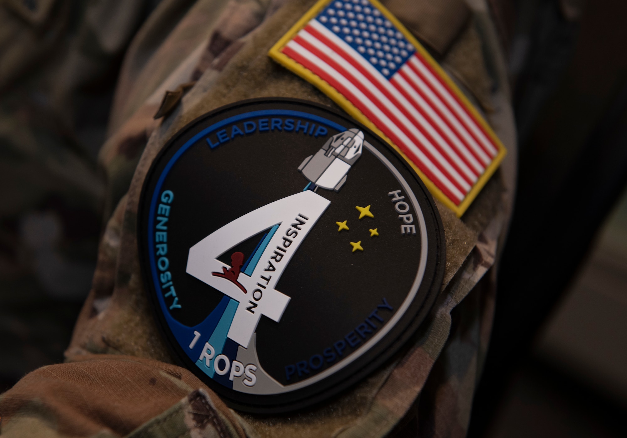 U.S. Space Force 1st Lt. Stephen Pitre, 1st Range Operations Squadron range engineer, wears an Inspiration4 patch on his uniform in support of the Inspiration4 launch Sept. 15, 2021, inside the Morrell Operations Center at Cape Canaveral Space Force Station, Florida. Pitre was part of a team of Guardians, Department of Defense civilians and U.S. Coast Guardsmen who supported the launch. The MOC supports every space launch from CCSFS and Kennedy Space Center. (U.S. Space Force photo by Tech. Sgt. James Hodgman)