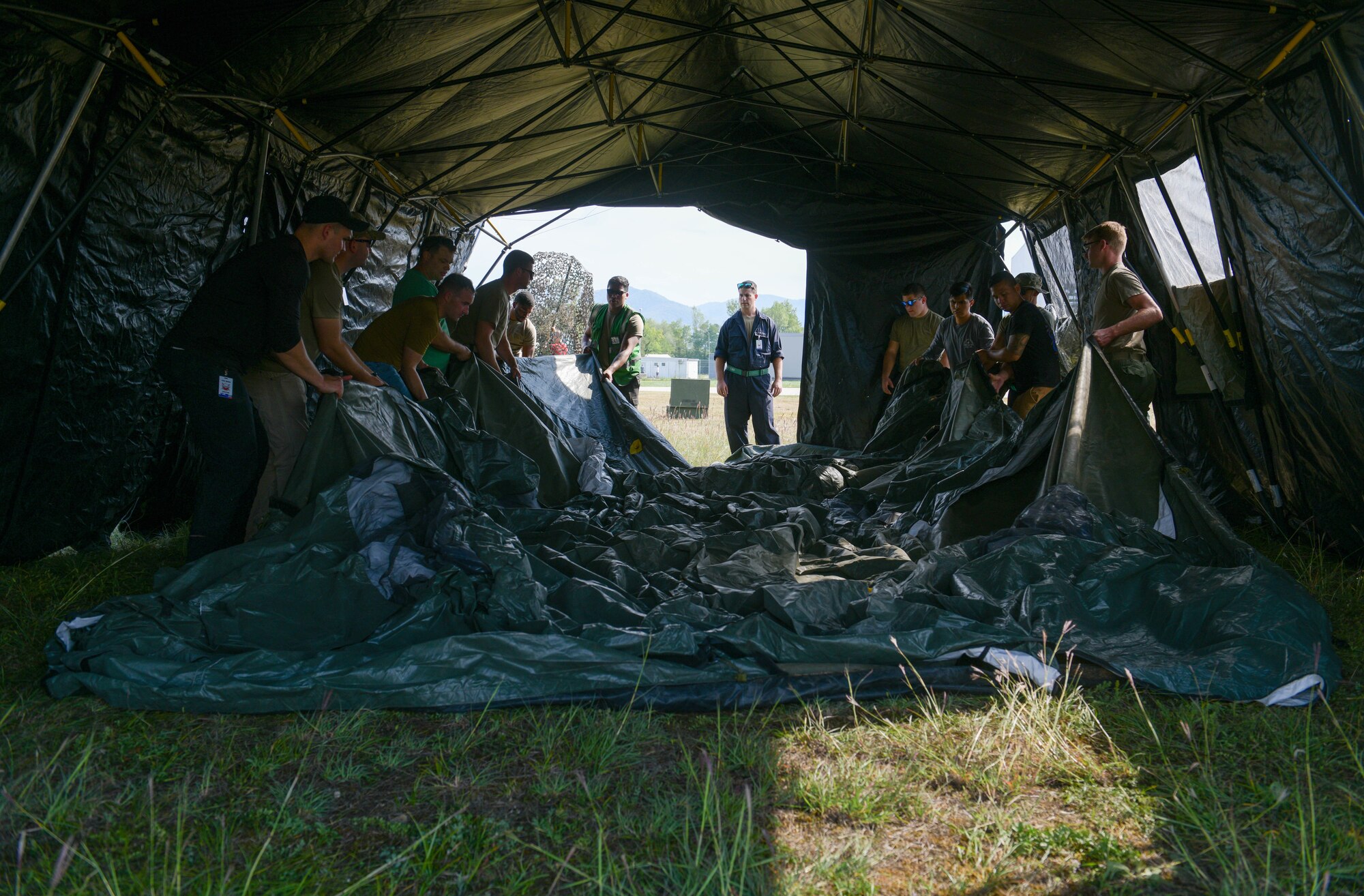 U.S. Air Force Airmen assigned to Aviano Air Base, Italy, assemble a tent in preparation for an Agile Combat Employment exercise at Cerklje ob Krki Air Base, Slovenia, Sept. 7, 2021. Exercises and deployments that utilize ACE concepts ensure the forces in Europe are ready to protect and defend partners, allies and U.S. interests at a moment’s notice, and generate lethal combat power should deterrence fail. (U.S. Air Force photo by Senior Airman Brooke Moeder)