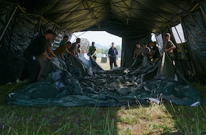 U.S. Air Force Airmen assigned to Aviano Air Base, Italy, assemble a tent in preparation for an Agile Combat Employment exercise at Cerklje ob Krki Air Base, Slovenia, Sept. 7, 2021. Exercises and deployments that utilize ACE concepts ensure the forces in Europe are ready to protect and defend partners, allies and U.S. interests at a moment’s notice, and generate lethal combat power should deterrence fail. (U.S. Air Force photo by Senior Airman Brooke Moeder)