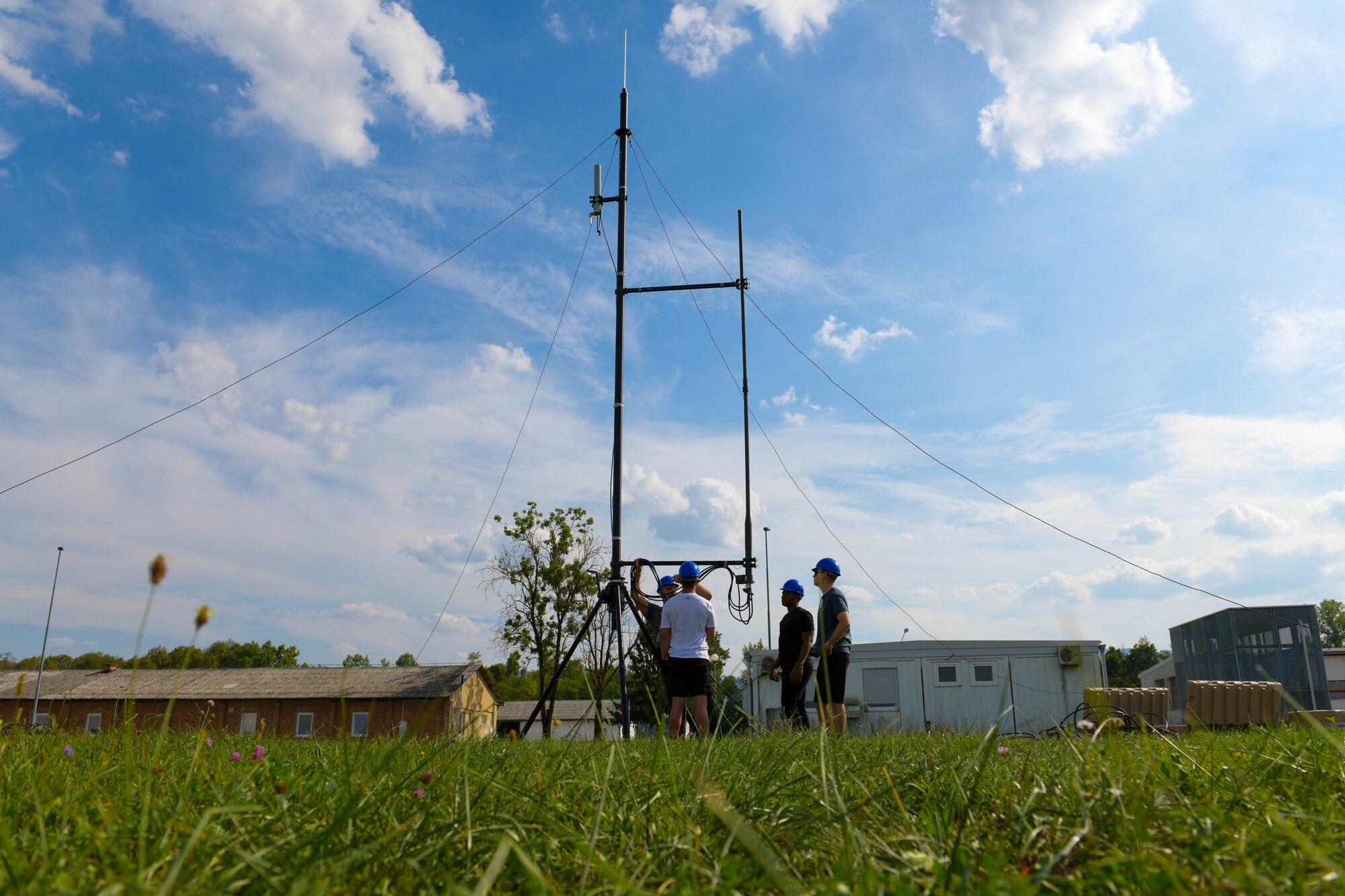 U.S. Air Force Airmen assigned to the 606th Air Control Squadron set up a BlueSky Mast in preparation for exercise Agile Wyvern at Cerklje ob Krki Air Base, Slovenia, Sept. 7, 2021. The BlueSky Mast holds up radars and communicates with aircraft participating in exercises. (U.S. Air Force photo by Senior Airman Brooke Moeder)
