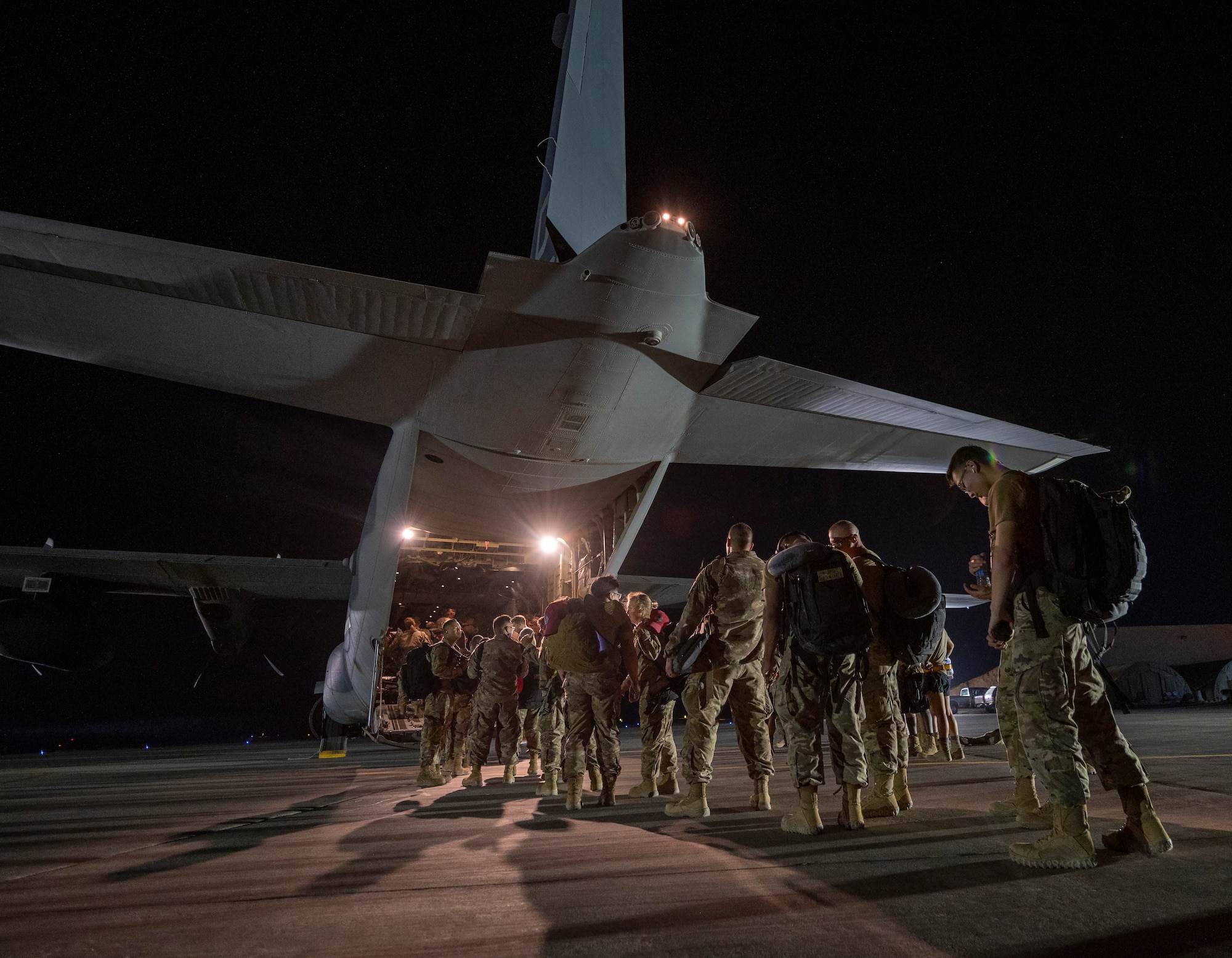 Airmen onload onto a U.S. Air Force aircraft