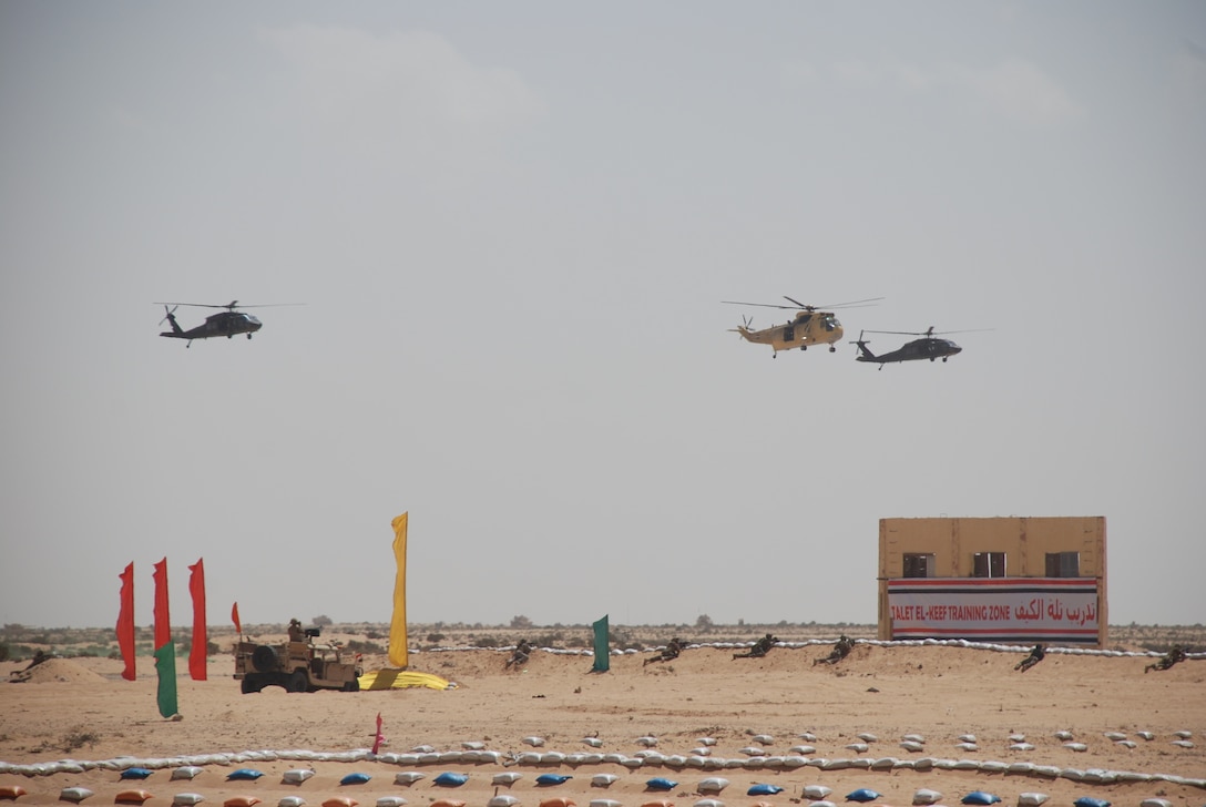 Partner nations Special Operations Forces assault a small village during Military Operations in Urban Terrain (MOUT) rehearsals at Bright Star 21, Sept. 13, in Mohamed Naguib Military Base, Egypt. BS21 tests the U.S. and partner forces' ability to work together, addressing realistic scenarios across land, air, and sea domains. The multi-lateral exercise allows full-spectrum military, interagency and ministerial response to near-peer and irregular warfare threats.  (U.S. Army photo by Maj. Daisy Bueno)