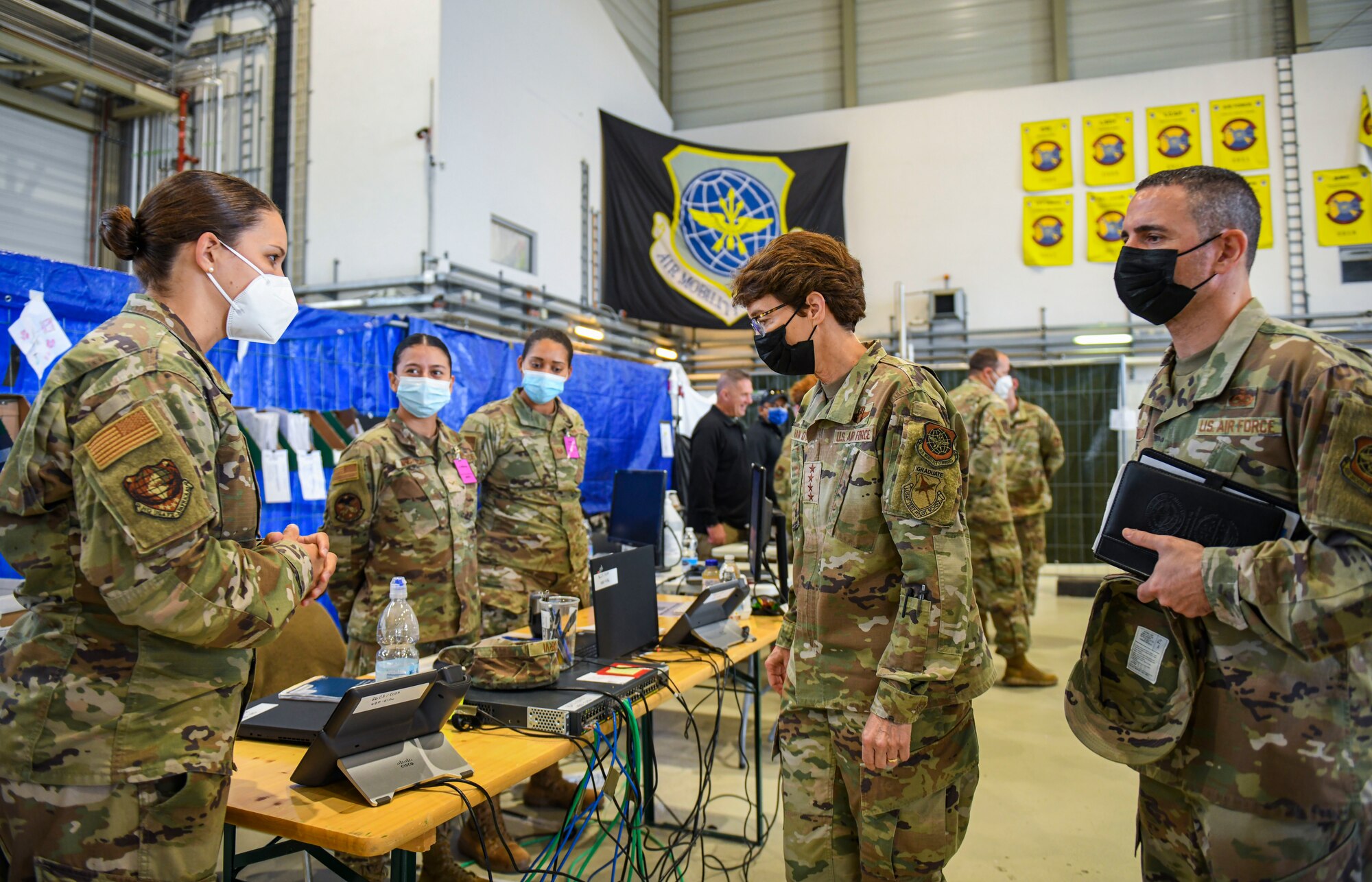 General is briefed by a Captain.