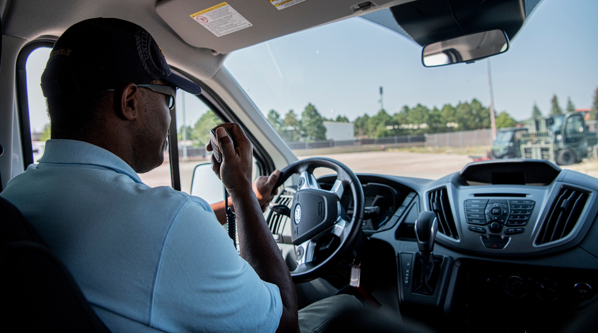 Taxi driver answering a request on his dispatch