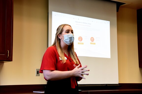 Laurin Kocurek, Abilene Chamber of Commerce vice president of operations and communications, shows the resources available to the Airmen of Dyess Air Force Base in Abilene, Texas, Sept. 1, 2021.