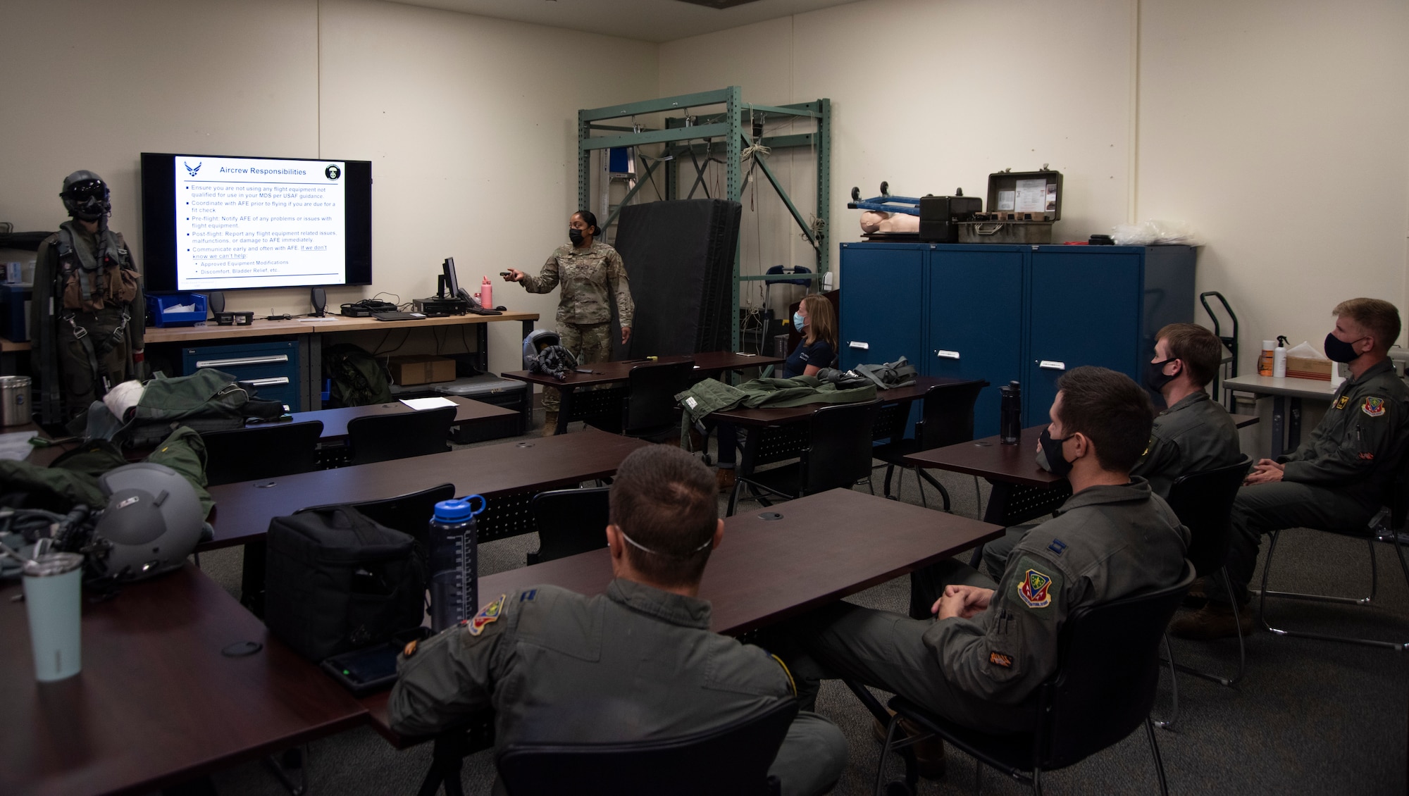 An Airman teaches a class about Aircrew Flight Equipment, with the Boise Mayor as a fellow student.