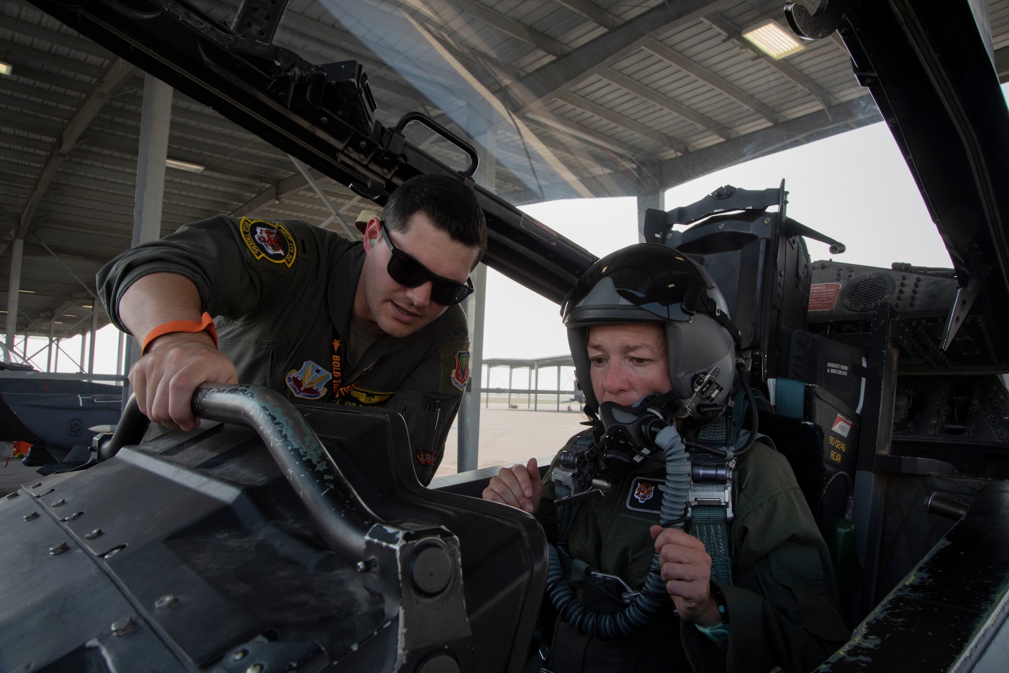 An Airman preps the Boise Mayor for her Orientation Flight on an F-15E Strike Eagle.