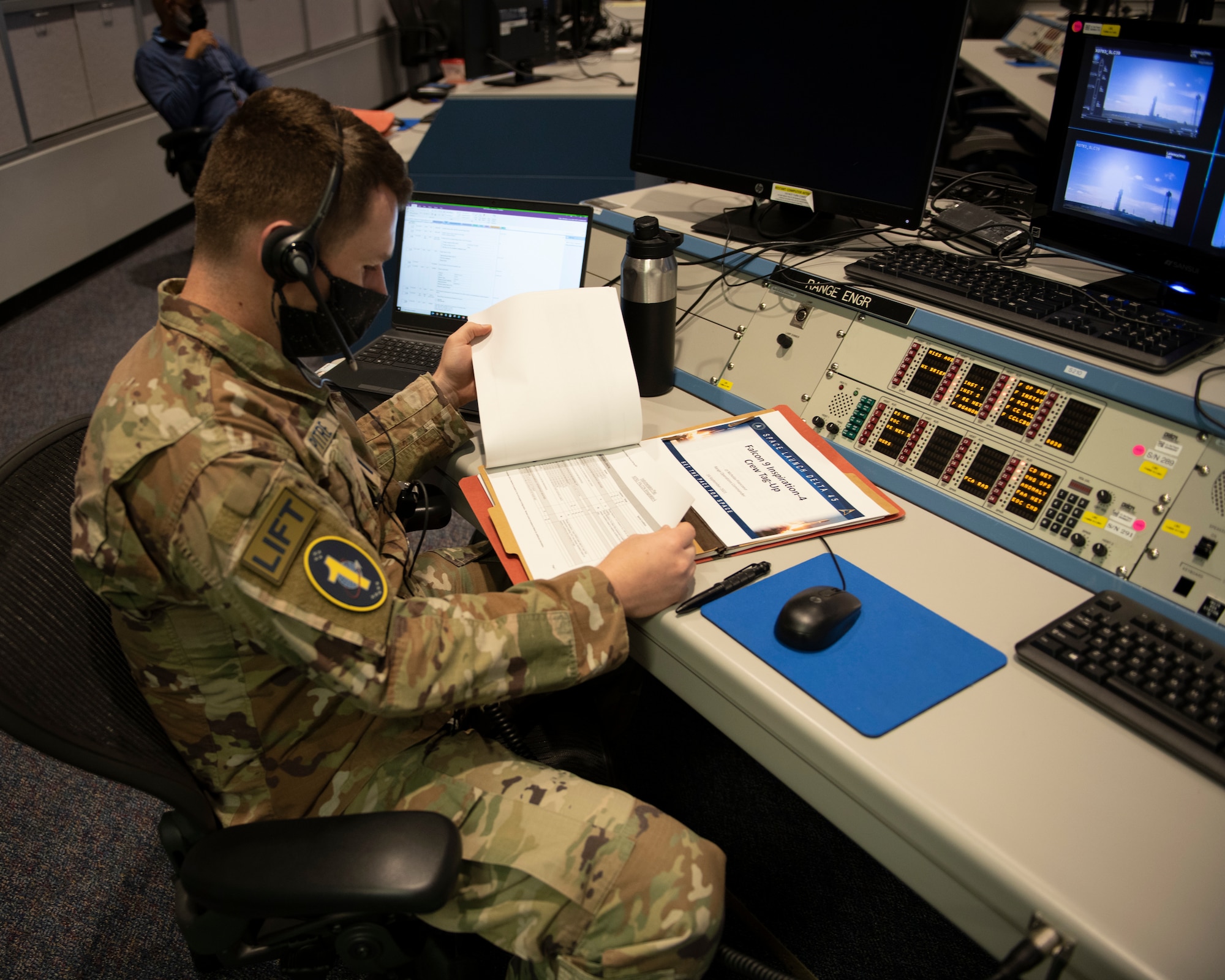 U.S. Space Force 1st Lt. Stephen Pitre, 1st Range Operations Squadron range engineer, reviews mission information in support of the Inspiration4 launch Sept. 15, 2021, inside the Morrell Operations Center at Cape Canaveral Space Force Station, Florida. The MOC supports every space launch from CCSFS and Kennedy Space Center. (U.S. Space Force photo by Tech. Sgt. James Hodgman)