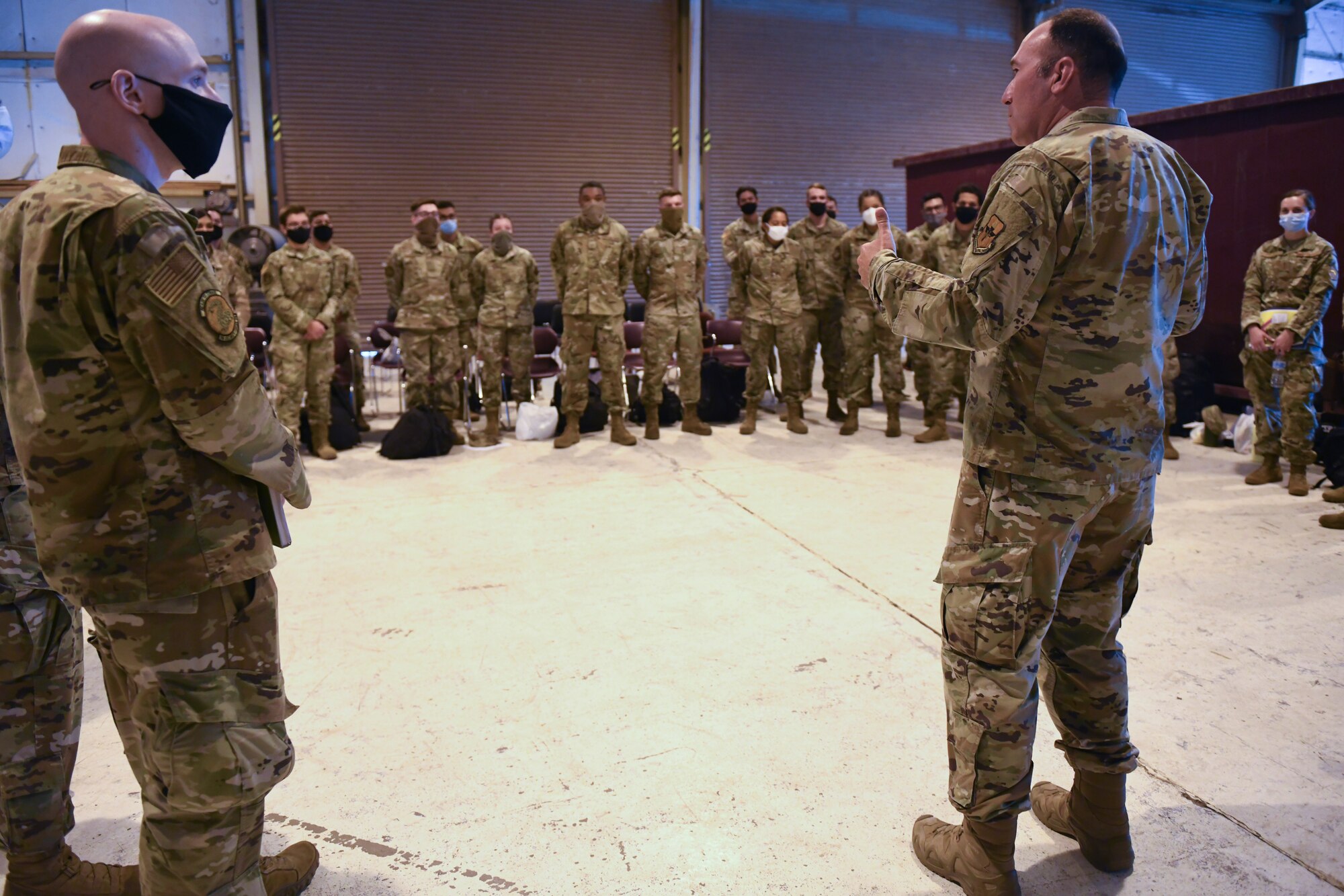 U.S. Air Force Chief Master Sgt. Daniel Weimer, right, 56th Fighter Wing command chief, speaks with Airmen ahead of a temporary deployment to Joint Base McGuire-Dix-Lakehurst, New Jersey, Sept. 13, 2021, at Luke Air Force Base, Arizona. More than 40 Airmen from multiple units deployed to JB MDL in support of Operation Allies Welcome and Joint Task Force Liberty humanitarian efforts. Luke Airmen rapidly mobilized to answer the call for support with less than a four-day notice to assist with the sheltering of thousands of Afghan evacuees from Kabul, Afghanistan. (U.S. Air Force photo by Tech. Sgt. Amber Carter)