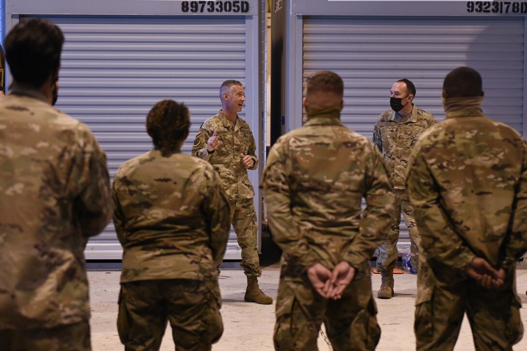 U.S. Air Force Brig. Gen. Gregory Kreuder, 56th Fighter Wing commander, left, and U.S. Air Force Chief Master Sgt. Daniel Weimer, right, 56th FW command chief, speaks with Airmen ahead of a temporary deployment to Joint Base McGuire-Dix-Lakehurst, New Jersey, Sept. 13, 2021, at Luke Air Force Base, Arizona. More than 40 Airmen from multiple units deployed to JB MDL in support of Operation Allies Welcome and Joint Task Force Liberty humanitarian efforts. Luke Airmen rapidly mobilized to answer the call for support with less than a four-day notice to assist with the sheltering of thousands of Afghan evacuees from Kabul, Afghanistan. (U.S. Air Force photo by Tech. Sgt. Amber Carter)