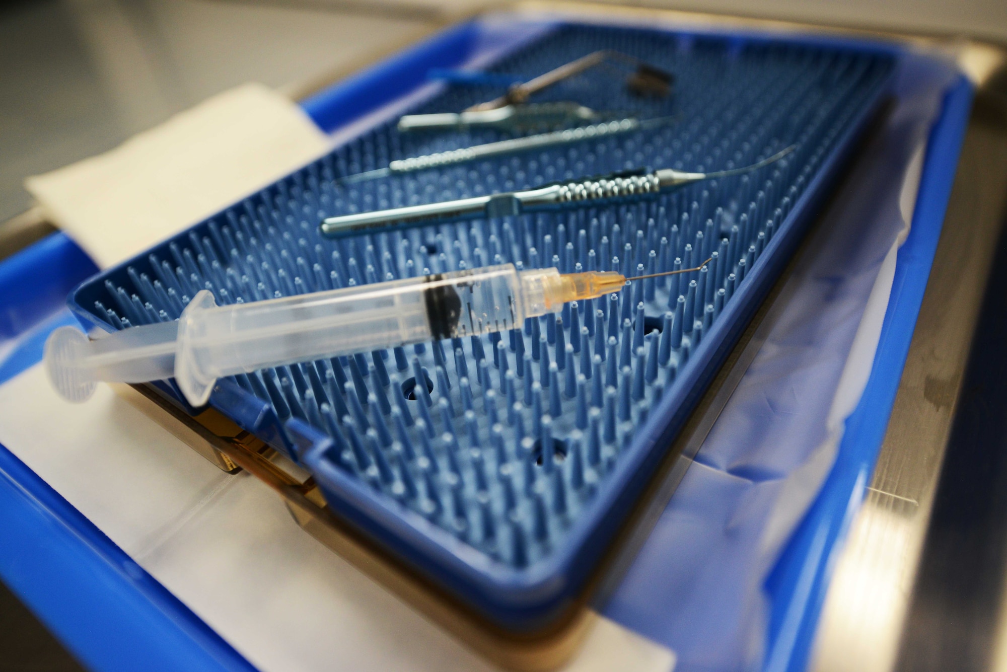 Lt. Col. Marcus Neuffer, chief surgeon assigned to the 10th Medical Group, Air Force Academy, Colo., and his staff, prepare to use medical instruments during a small incisional lenticular extraction (SMILE) eye surgery, Aug. 19, 2021.