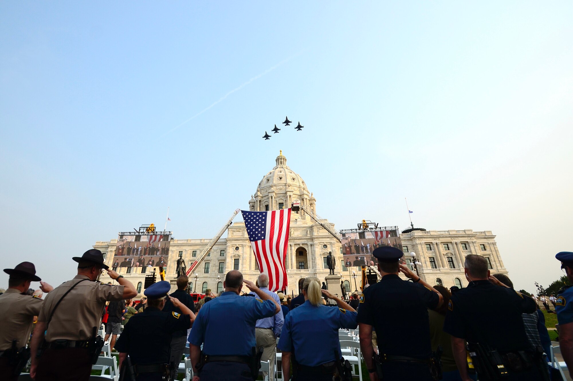 Four F-16 Fighting Falcons from the 148th Fighter Wing, Minnesota National Guard, fly over the Minnesota State Capitol, Sept. 11, 2021.