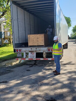 Rampreet Singh, general supply specialist, loads excess equipment from Detroit District area office’s onto a flat-bed truck headed to a UNICOR facility in Kansas for recycling.