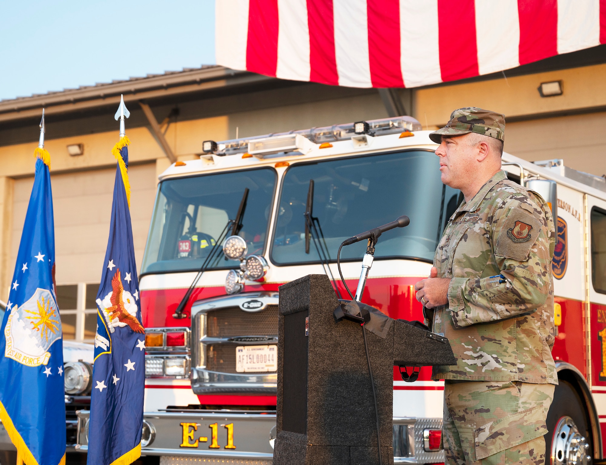Col. Patrick Miller, 88th Air Base Wing and installation commander, delivers remarks during the 9/11 commemoration ceremony Sept. 10, 2021, in front of the main firehouse  at Wright-Patterson Air Force Base, Ohio. Miller praised heroics of the first responders that day and how they continue to inspire. (U.S. Air Force photo by R.J. Oriez)