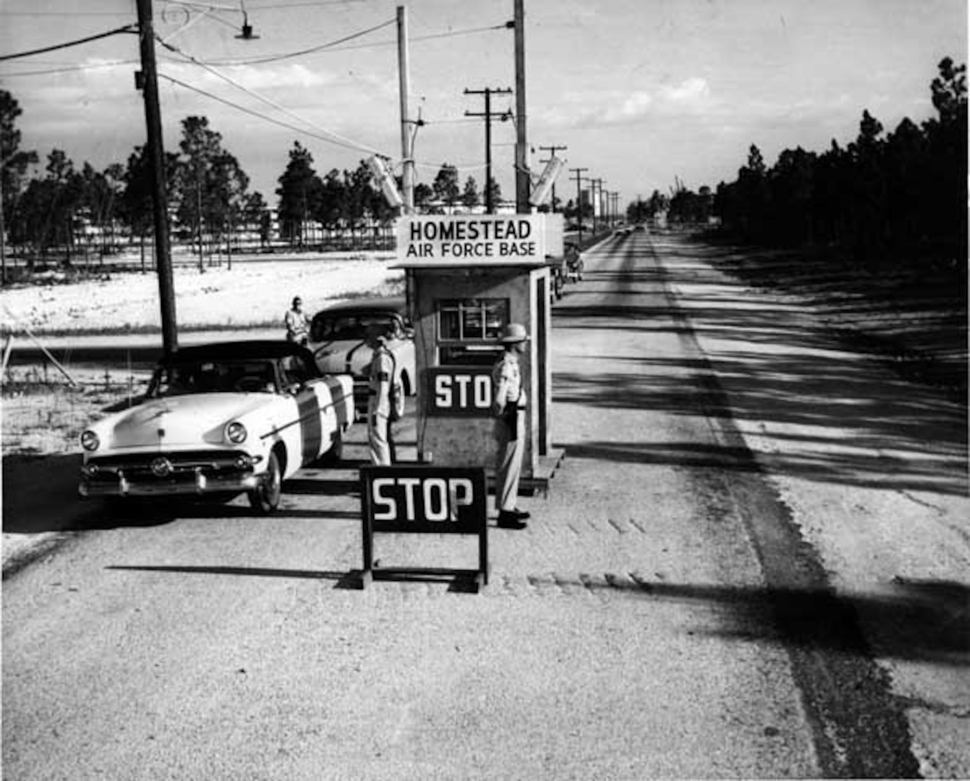 Members enter the Homestead Air Force Base front gate. This photo ran in the Miami news on June 09, 1957.