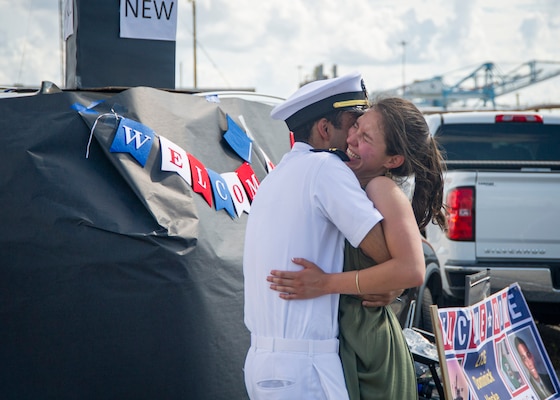 Lt. j.g. Dominick Vaske, assigned to the Virginia-Class fast-attack submarine USS New Mexico (SSN 779), embraces his significant other during the boat’s homecoming at Naval Station Norfolk, Sept. 15, 2021.