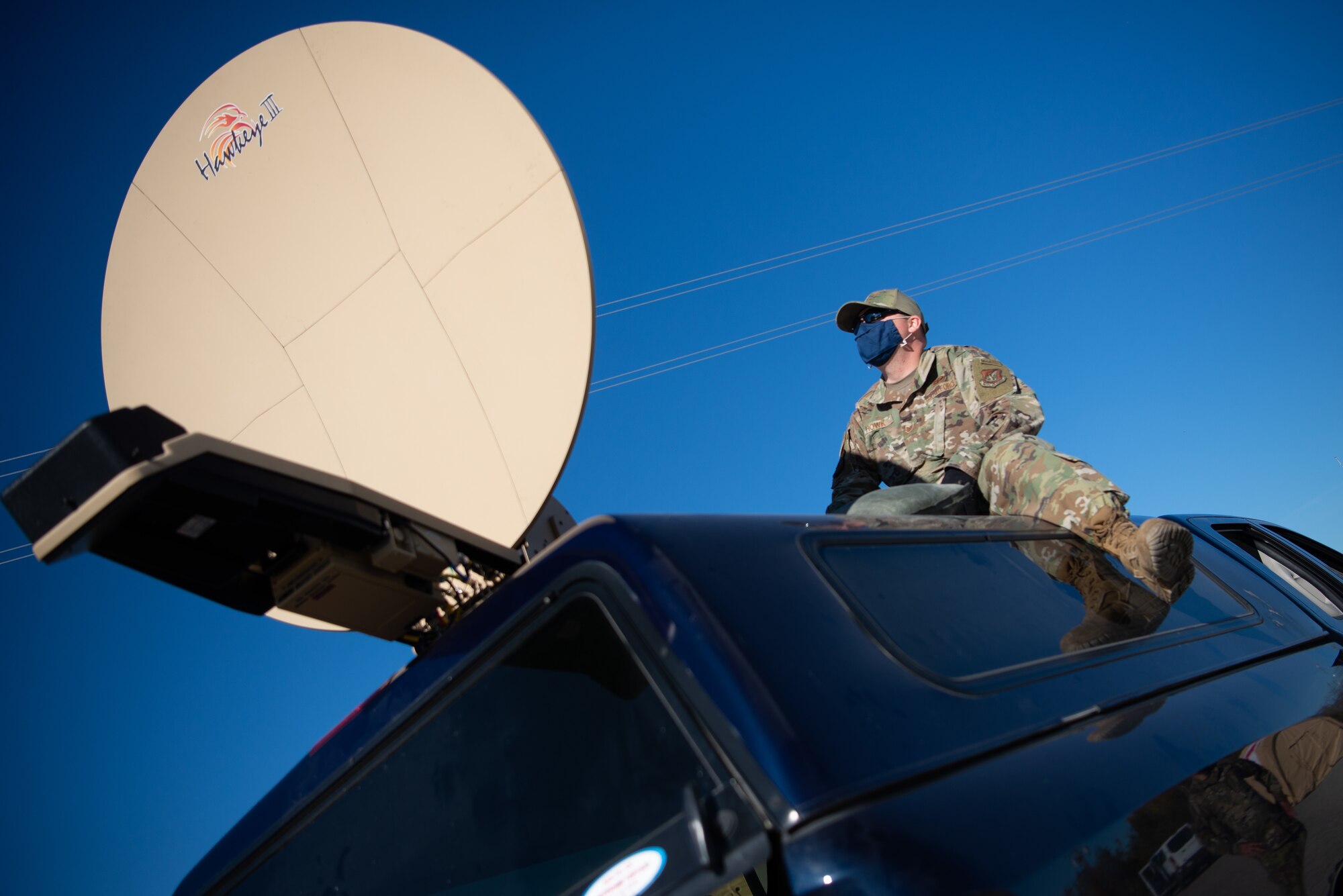 U.S. Air Force Tech. Sgt. Gerald Hawk, the 354th Contracting Squadron tactical communication noncommissioned officer in charge, sets up communication equipment during a Capabilities-Based Assessment at the Yukon Training Area, Sept. 14, 2021.